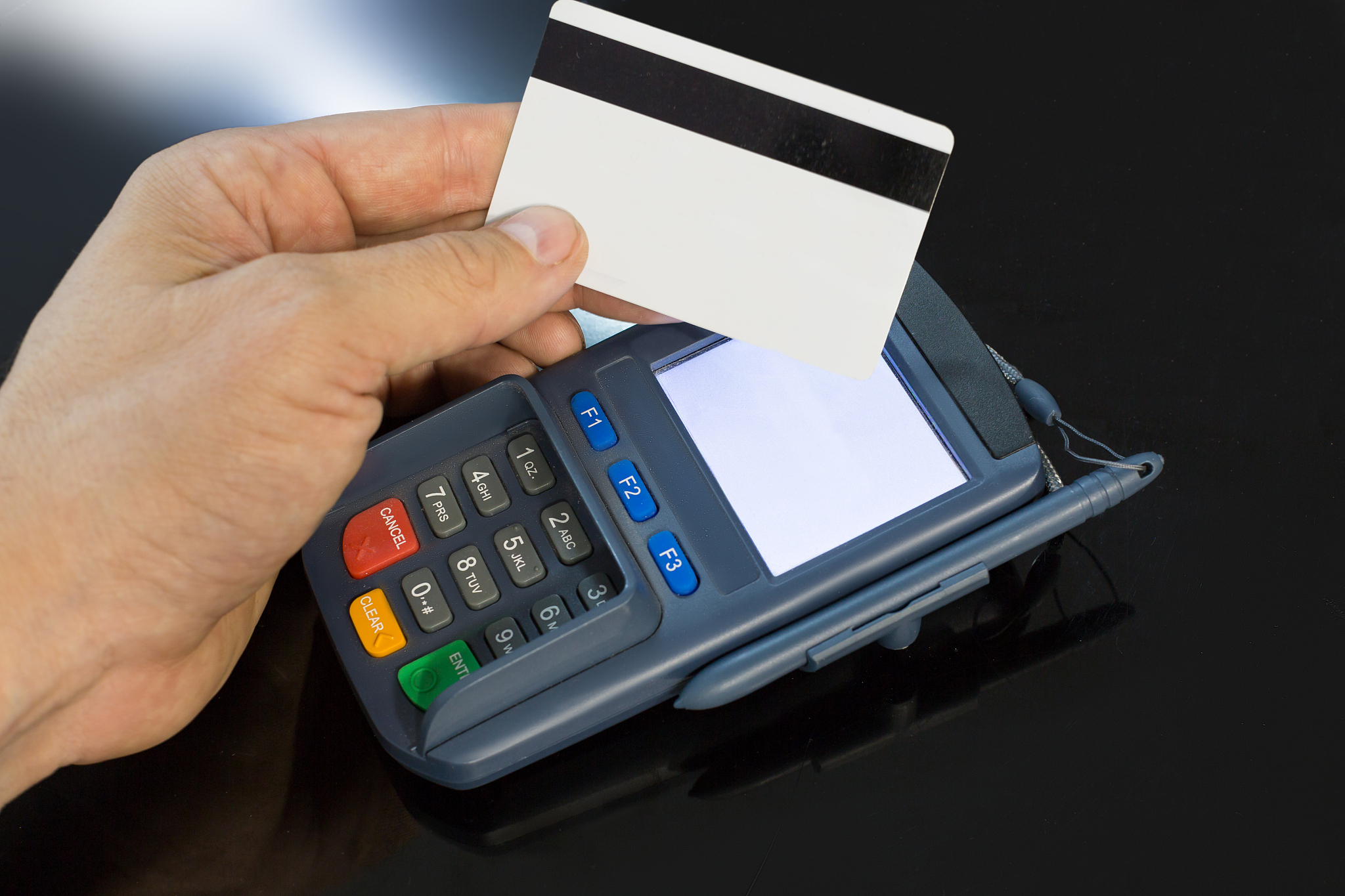 close up photo of a payment terminal charging from a card.