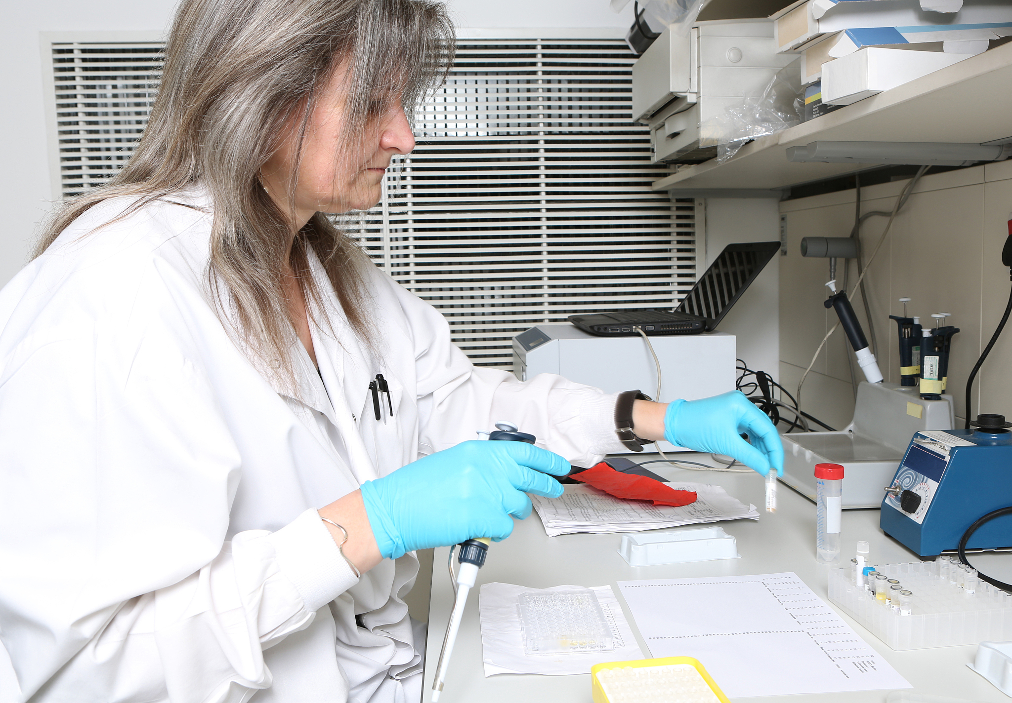 female bio medical researcher working