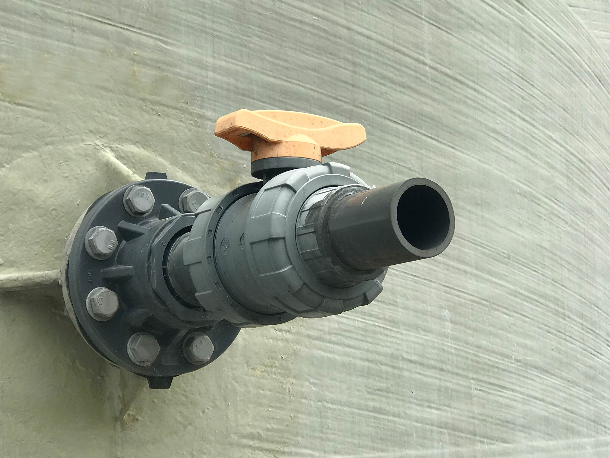 big pvc pipe and valve at fiber glass tank, industrial concept