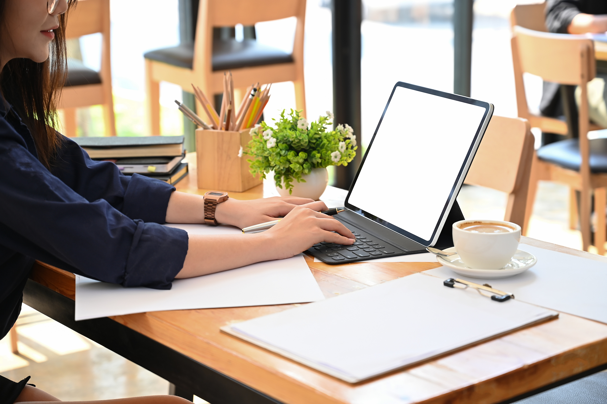 women working with mockup tablet on table in office co working.
