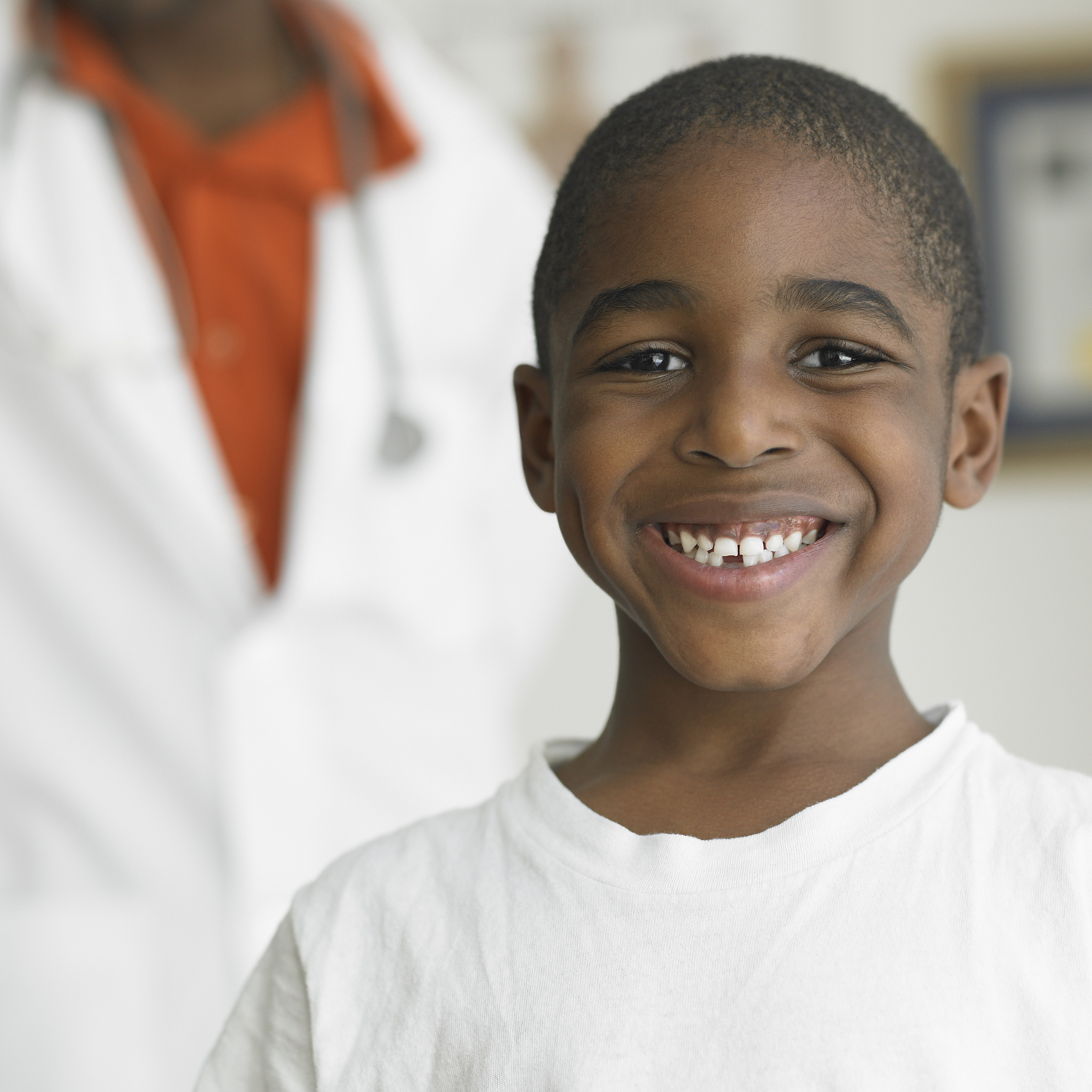 smiling young boy visiting his doctor