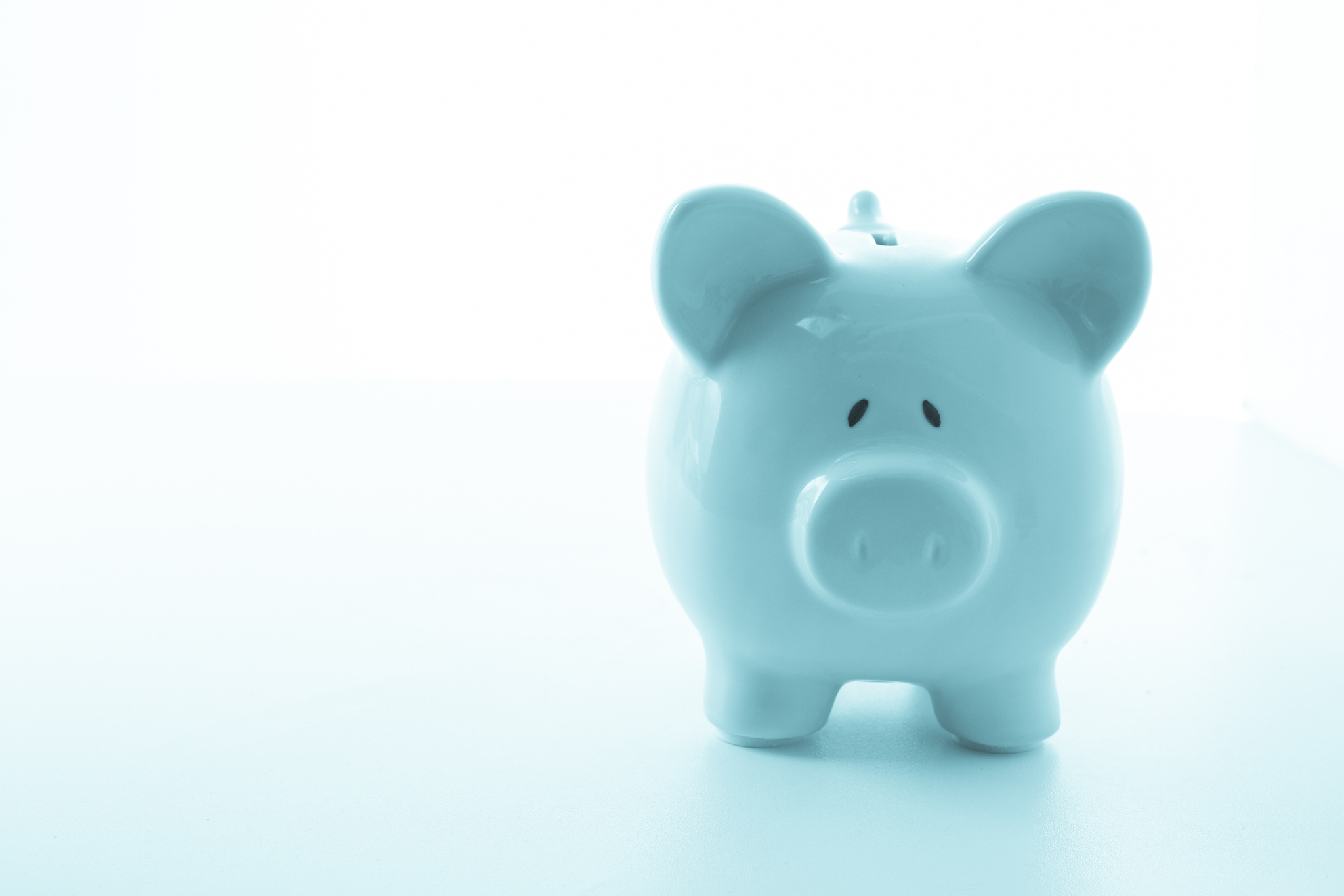 ceramic blue piggy bank with copy space