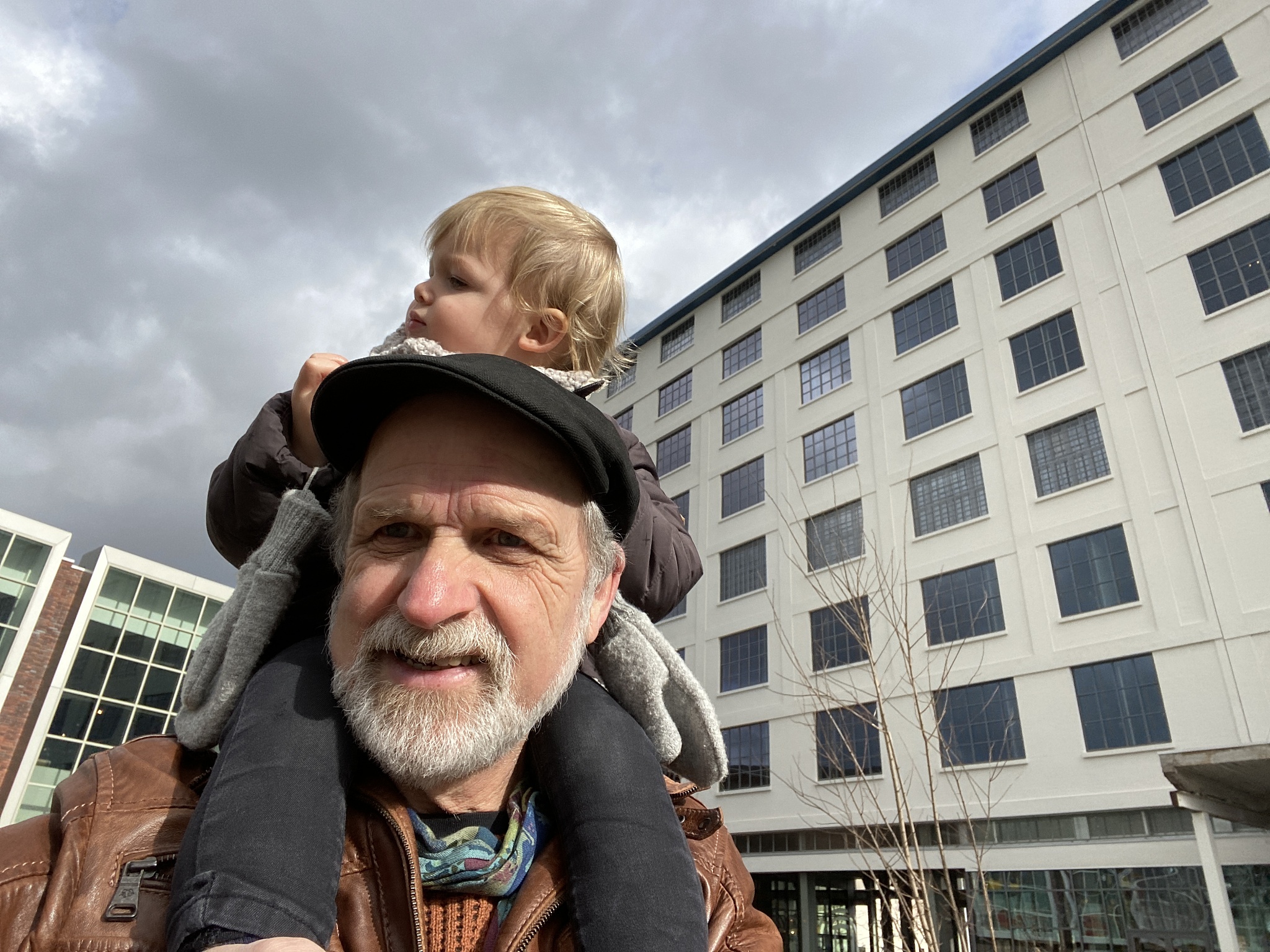 grandfather with grandson in shoulder