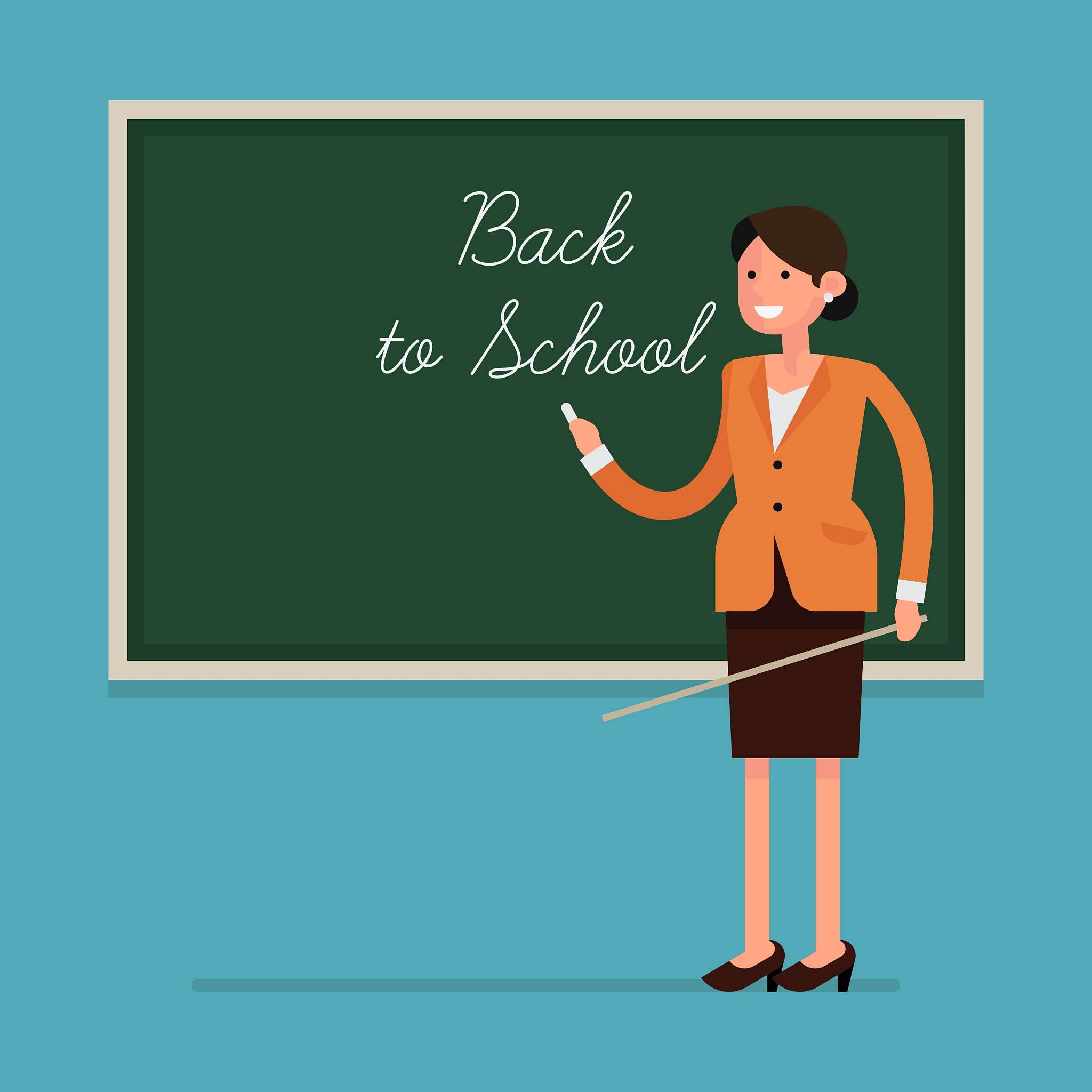 teacher in a classroom with a blackboard
