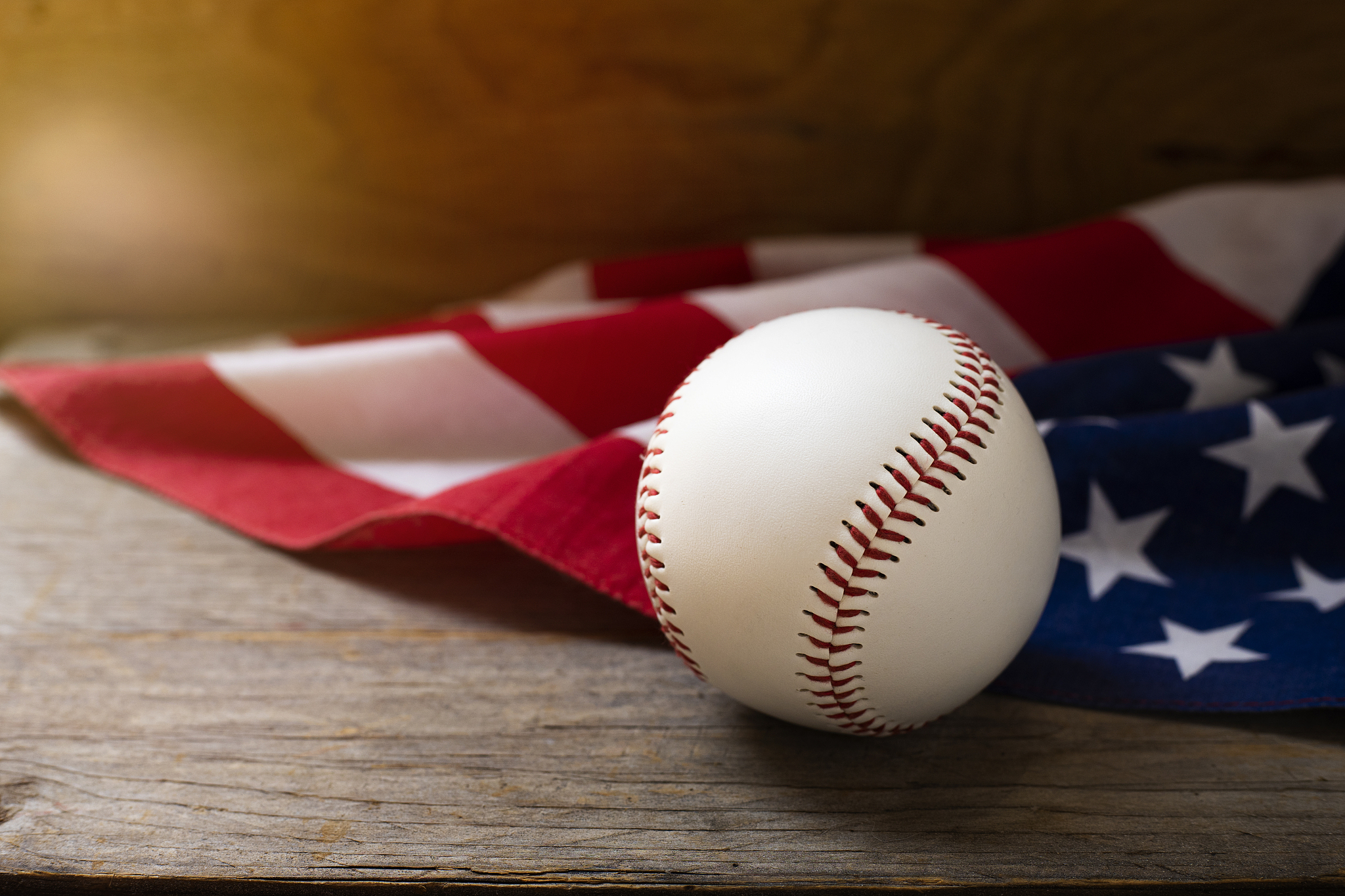 baseball with american flag on the wooden table background
