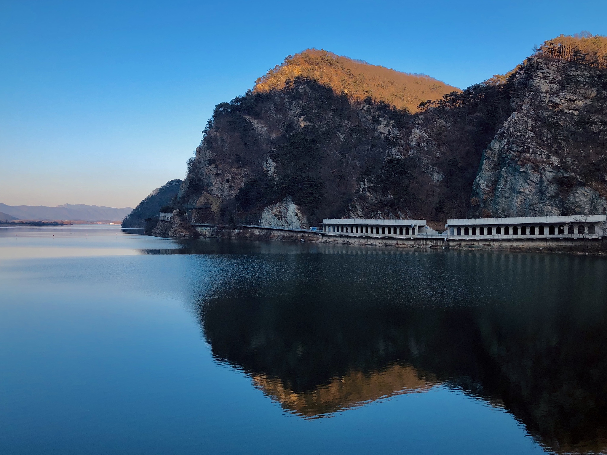 scenic view of mountains against clear blue sky