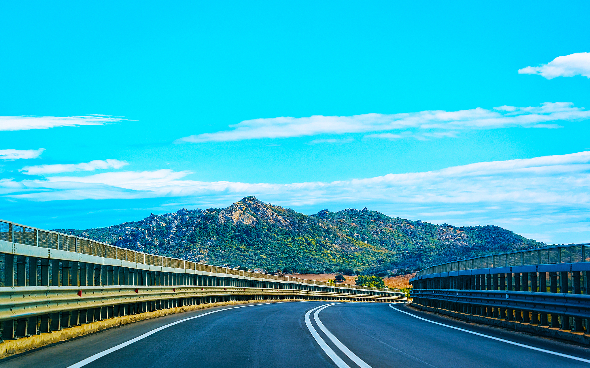 empty road without cars at sardinia island in italy reflex