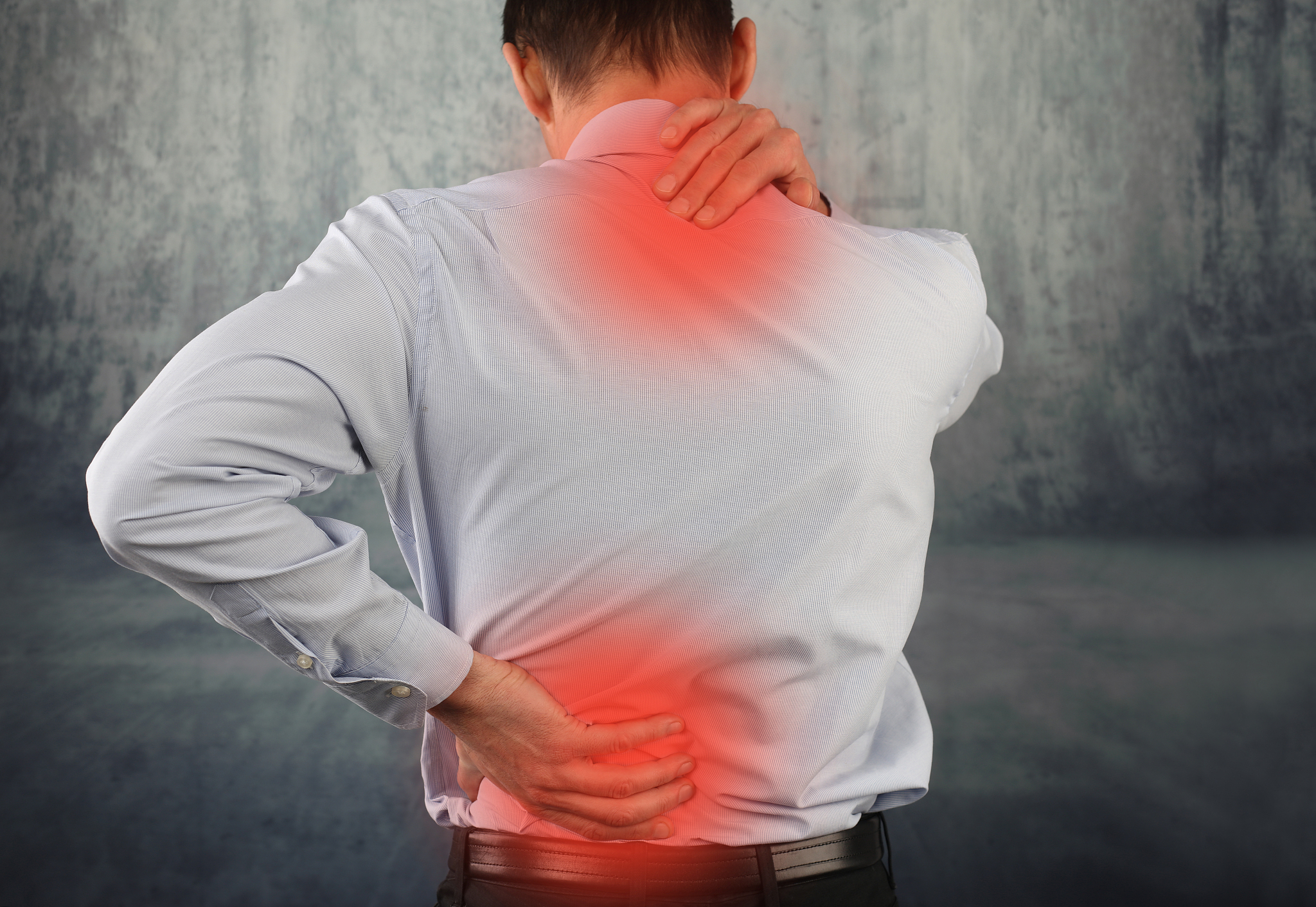 business man suffering from neck and back pain