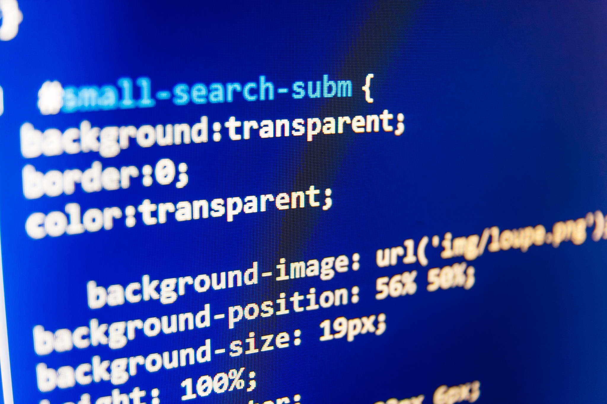 software developer programming code on computer