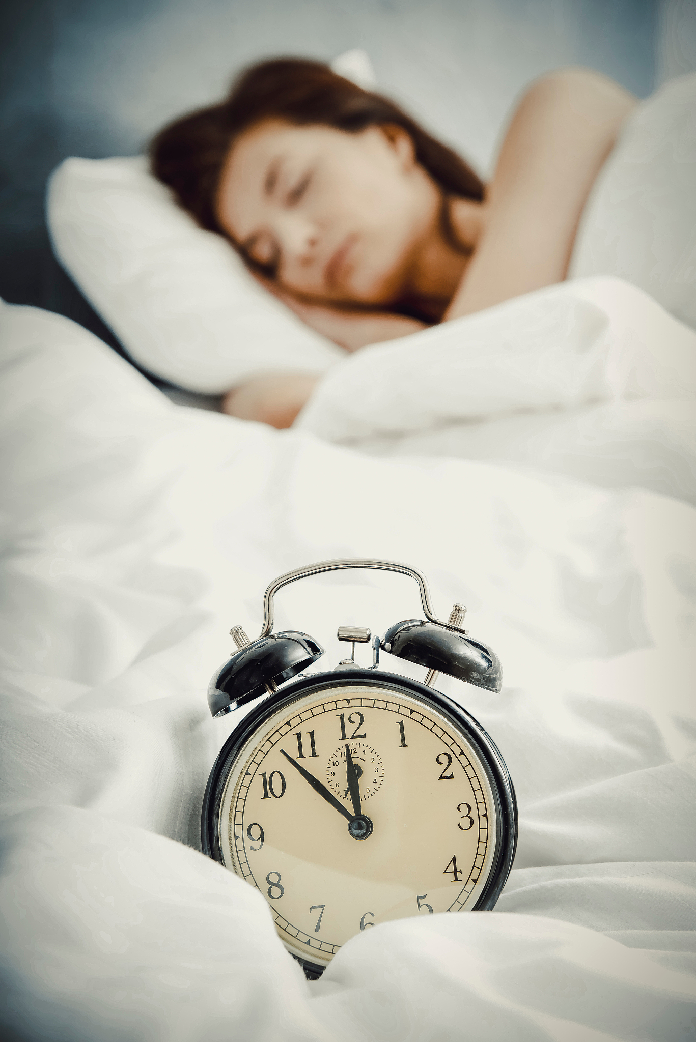 woman sleeping on bed
