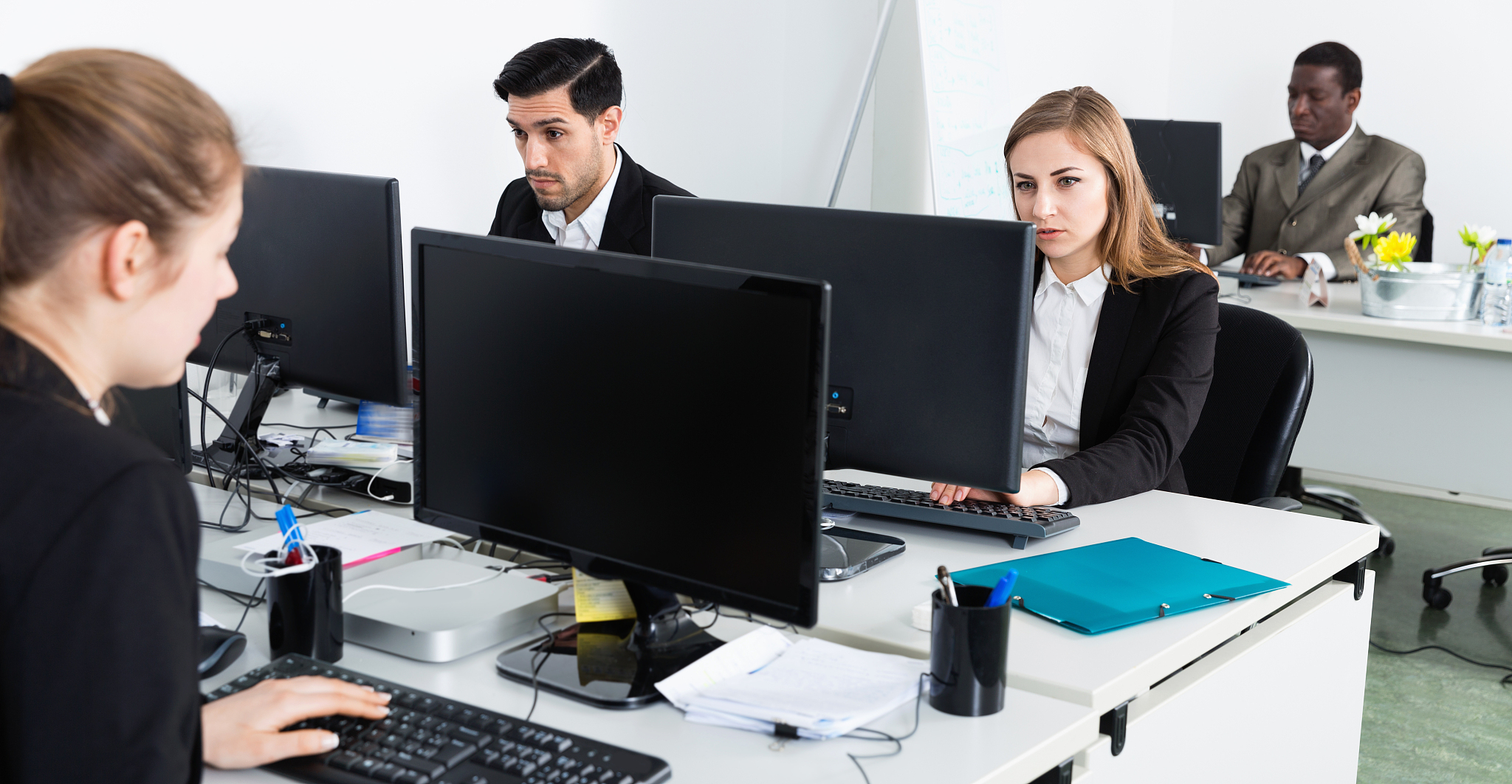 successful coworkers engaged in business activities in busy open