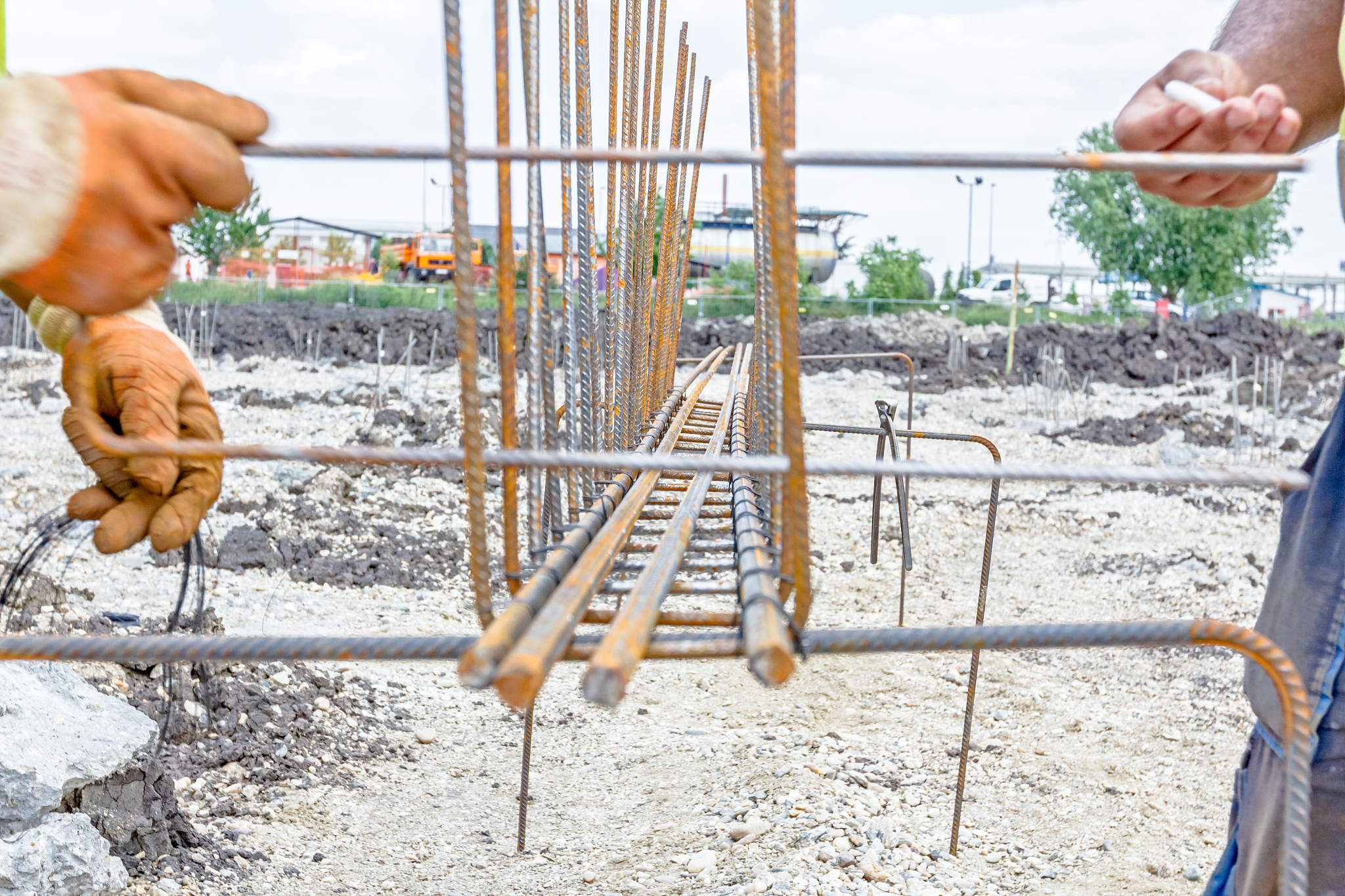 construction worker is marking place to binding rebar.