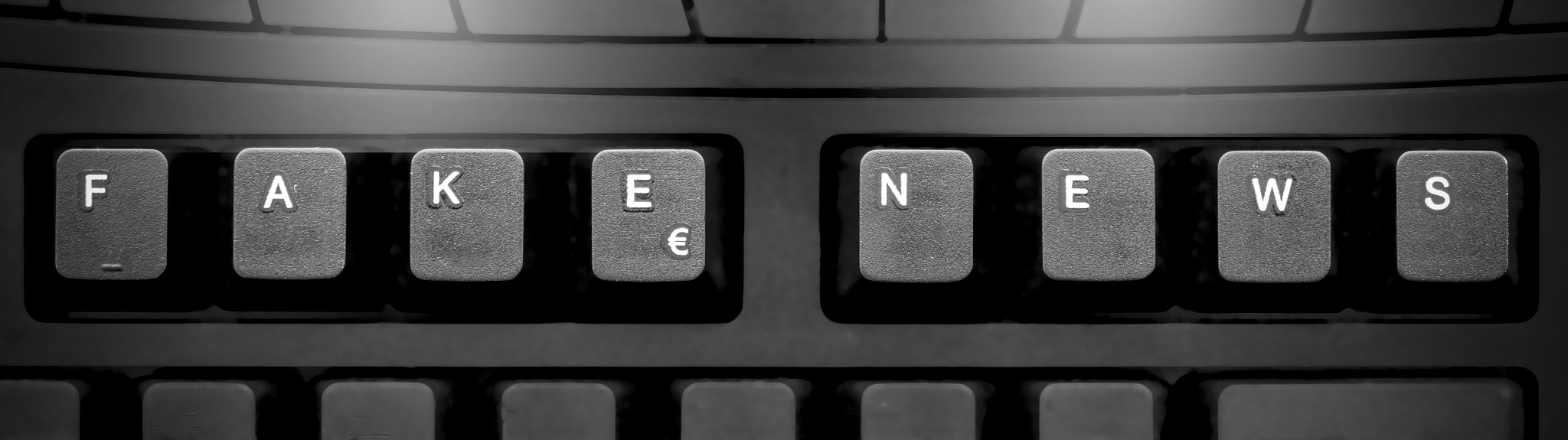 computer keyboard showing fake news