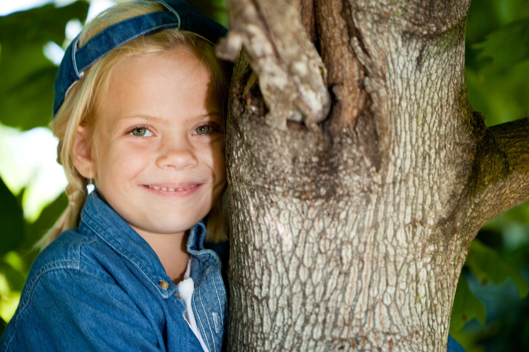 tomboy smiling in tree