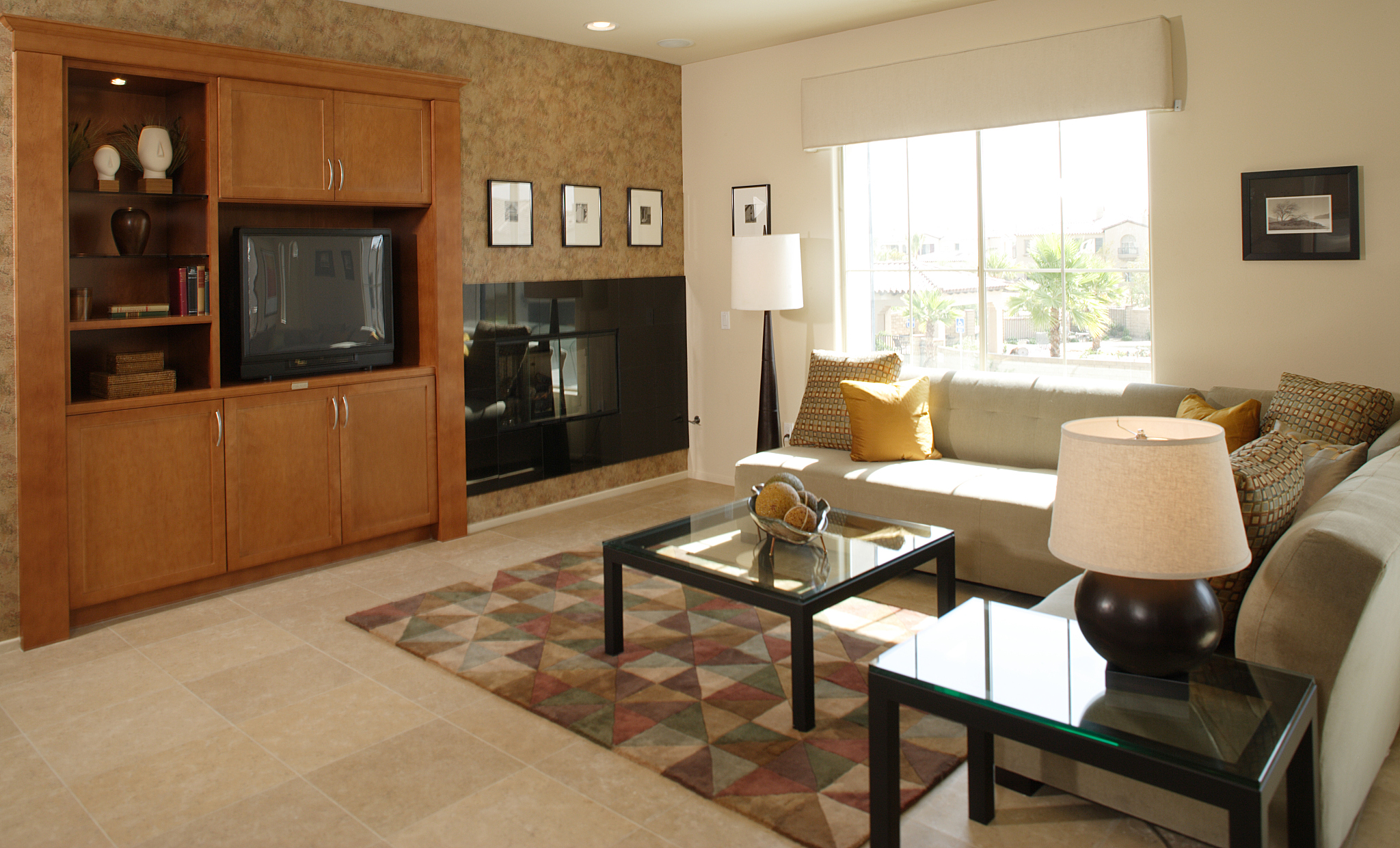 entertainment center and fireplace on wall of living room