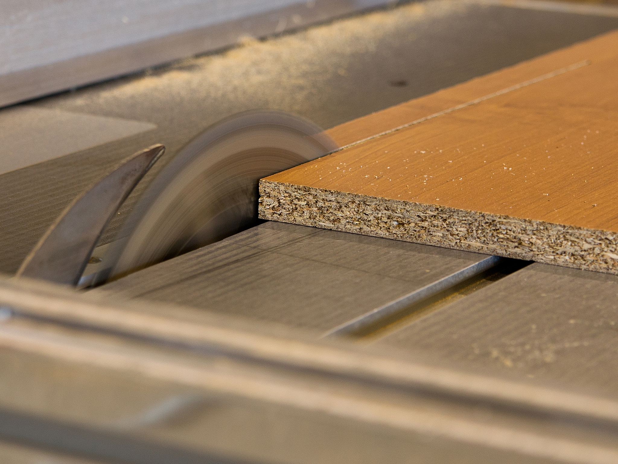 circular saw cutting wood board
