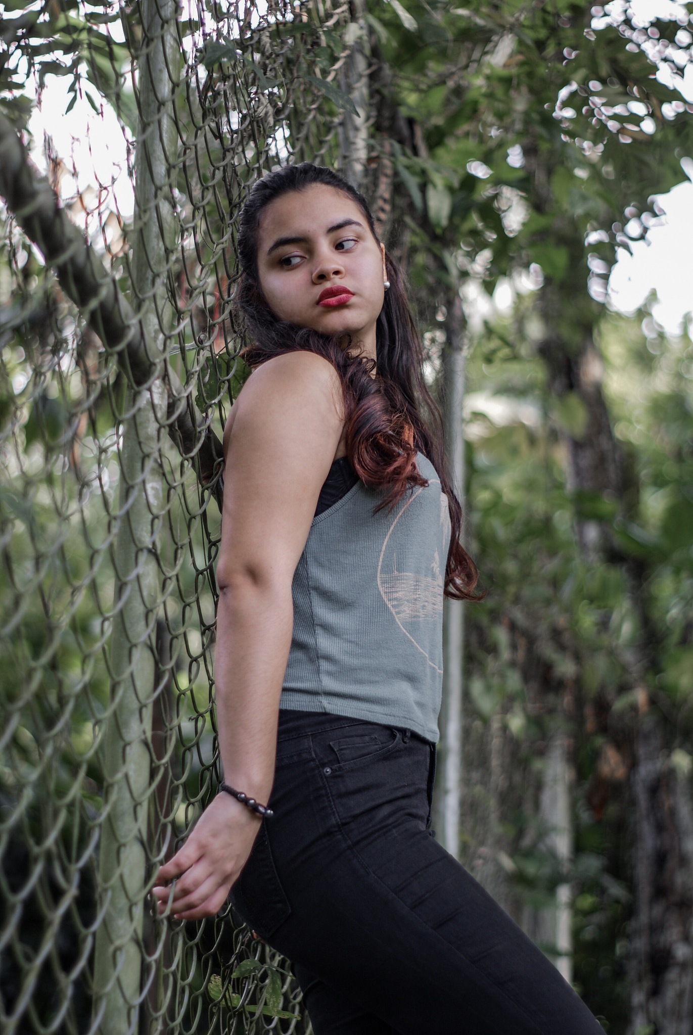 low angle view of beautiful woman looking away while standing by