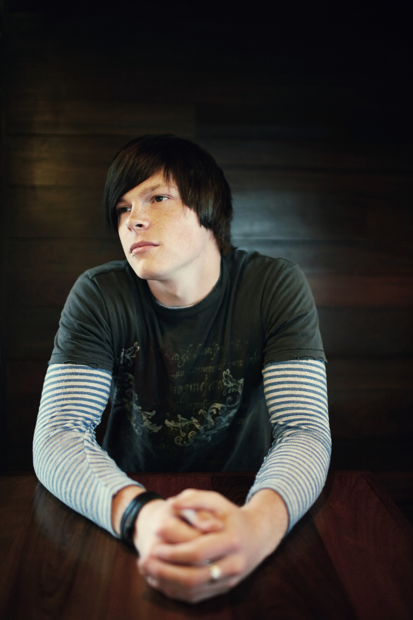 male with striped undershirt in coffee shop