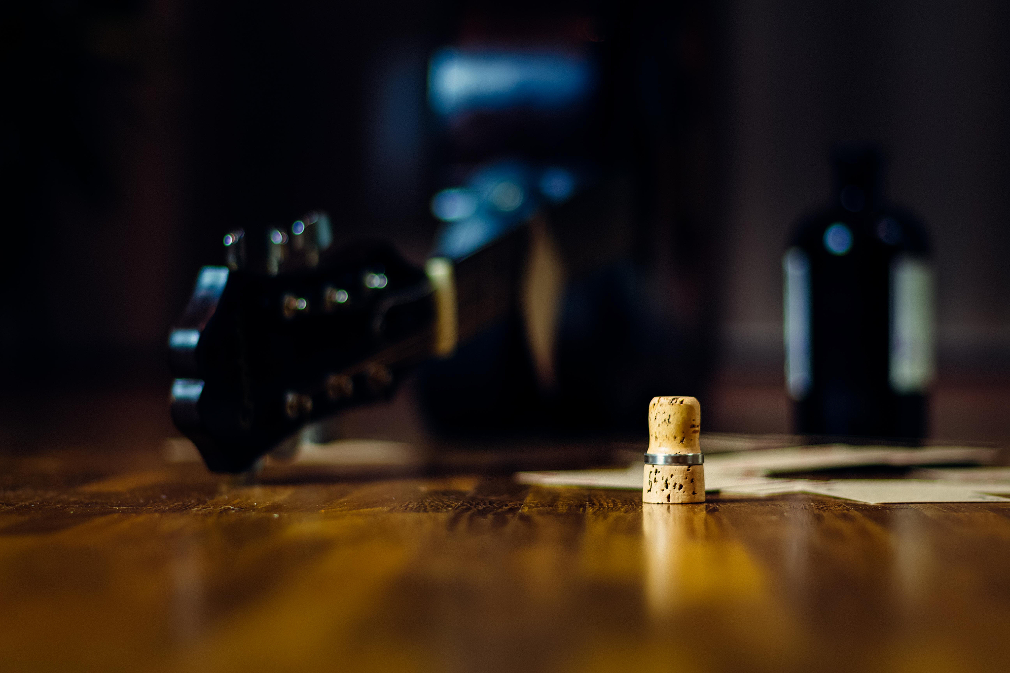 liquor bottle, playing cards and guitar as a concept for alcohol