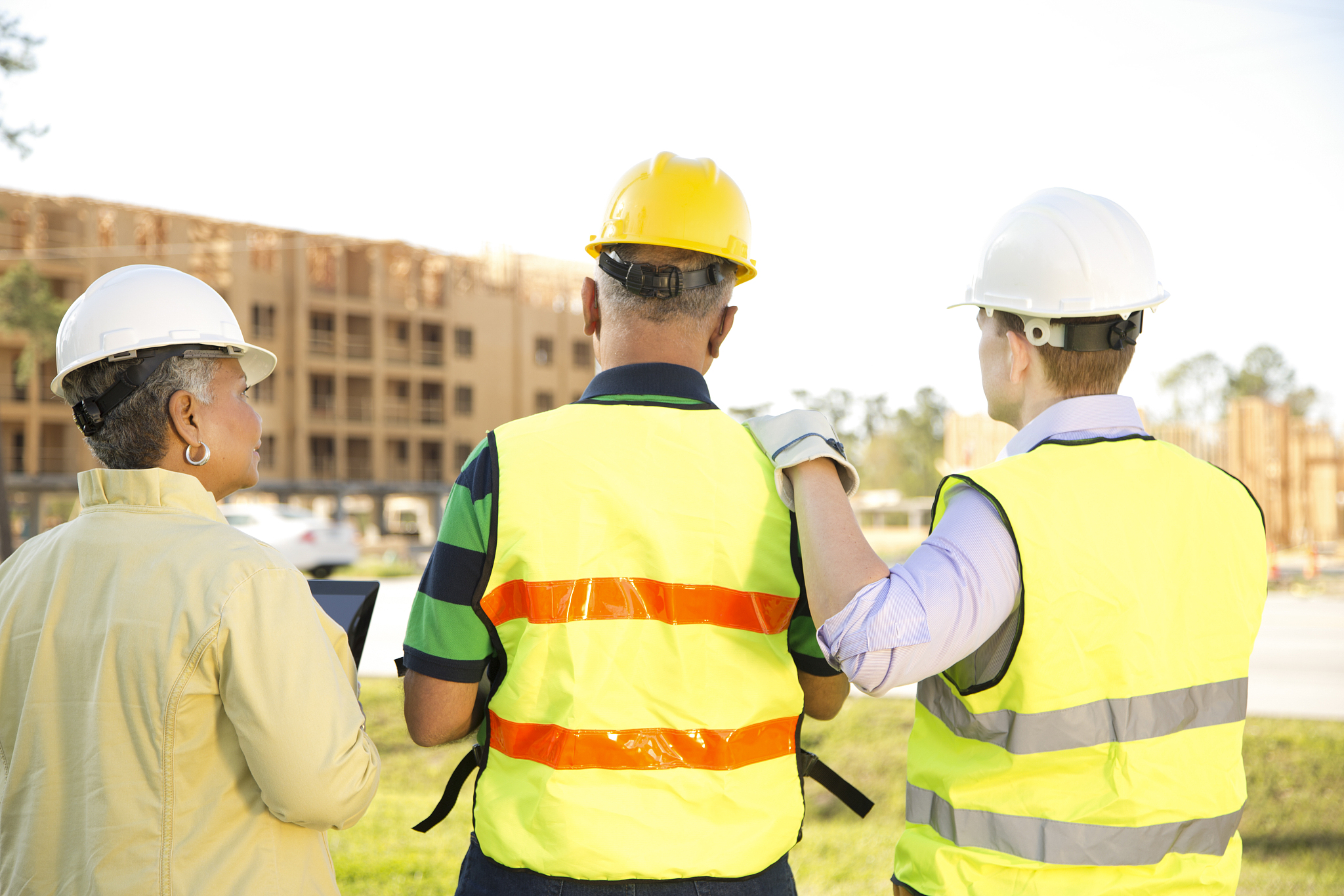 multi-ethnic team of construction engineer, architect and worker
