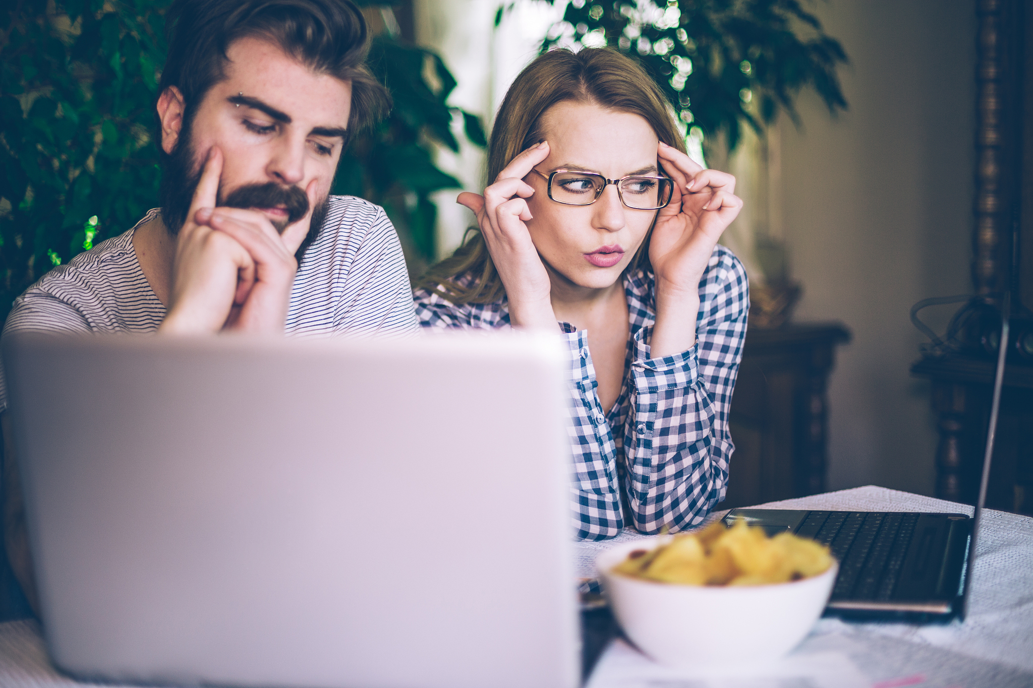 young couple trying to solve the problem