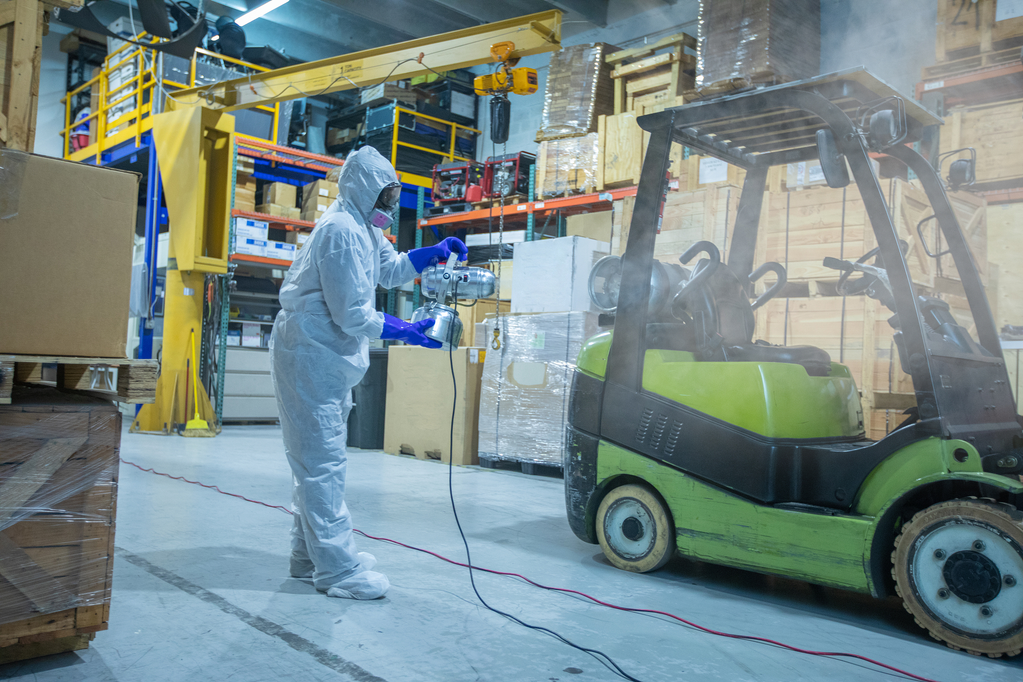 professional sanitation worker on warehouse miami during covid-1