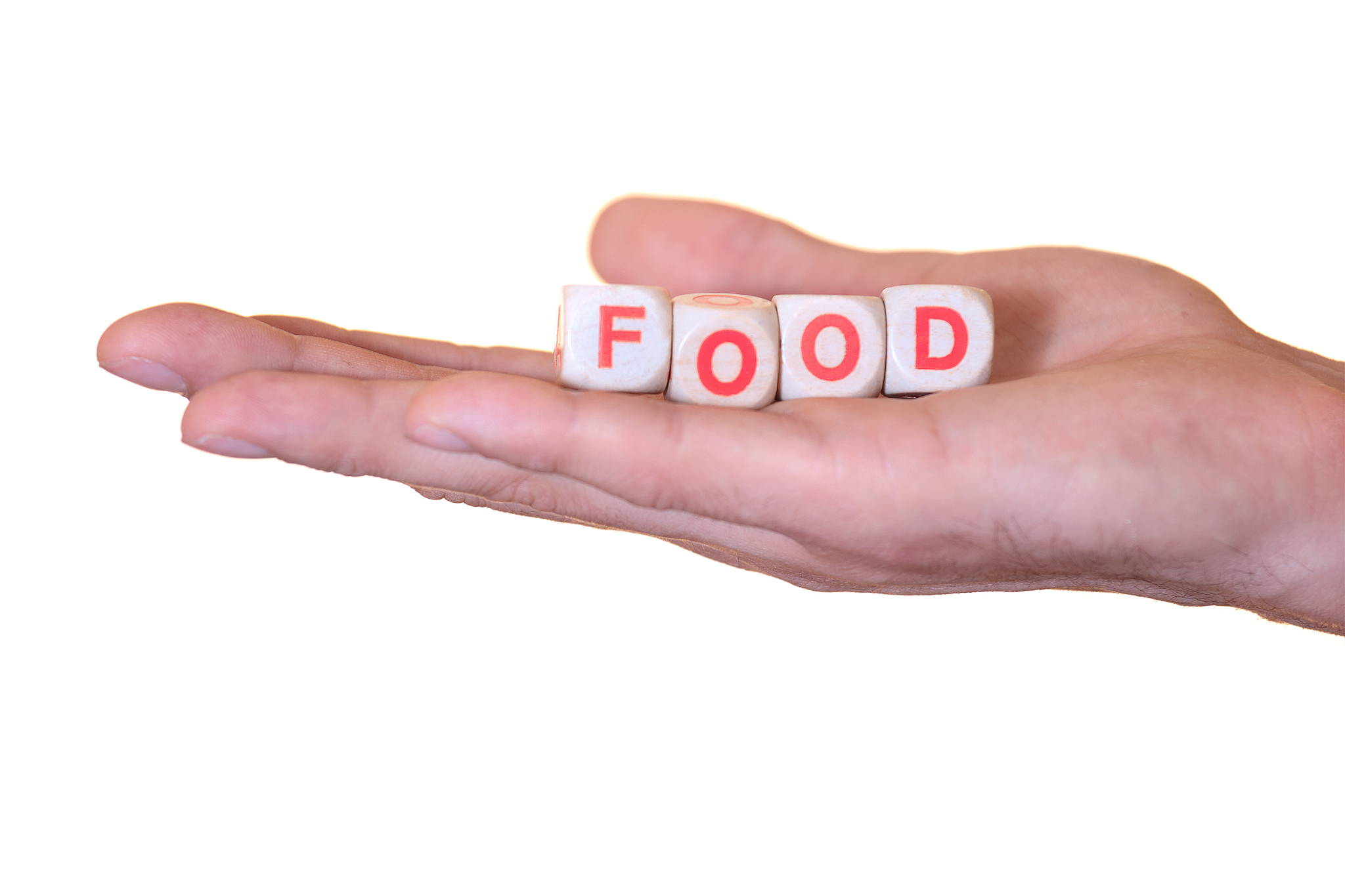 food written with wooden dice on a isolated hand