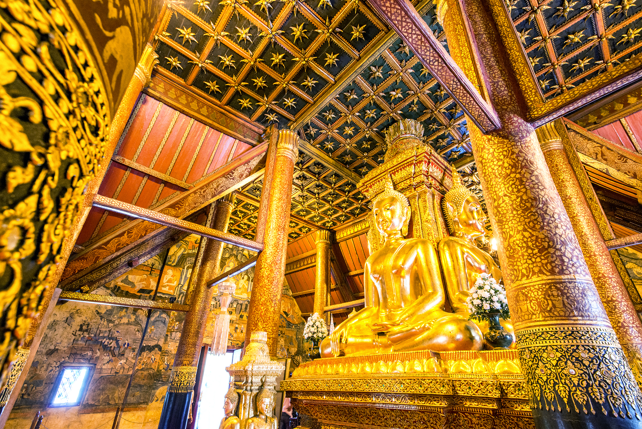 golden buddha statue at wat phu min temple, nan province, northe