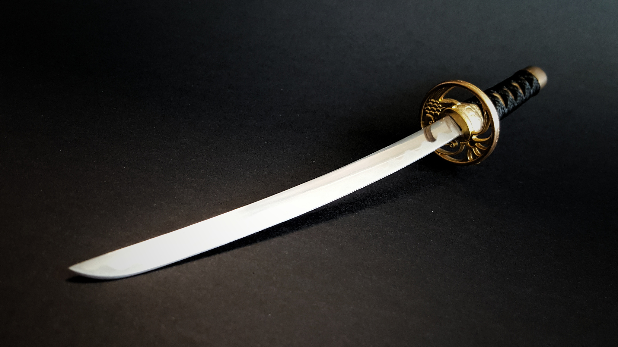 high angle view of sword on table