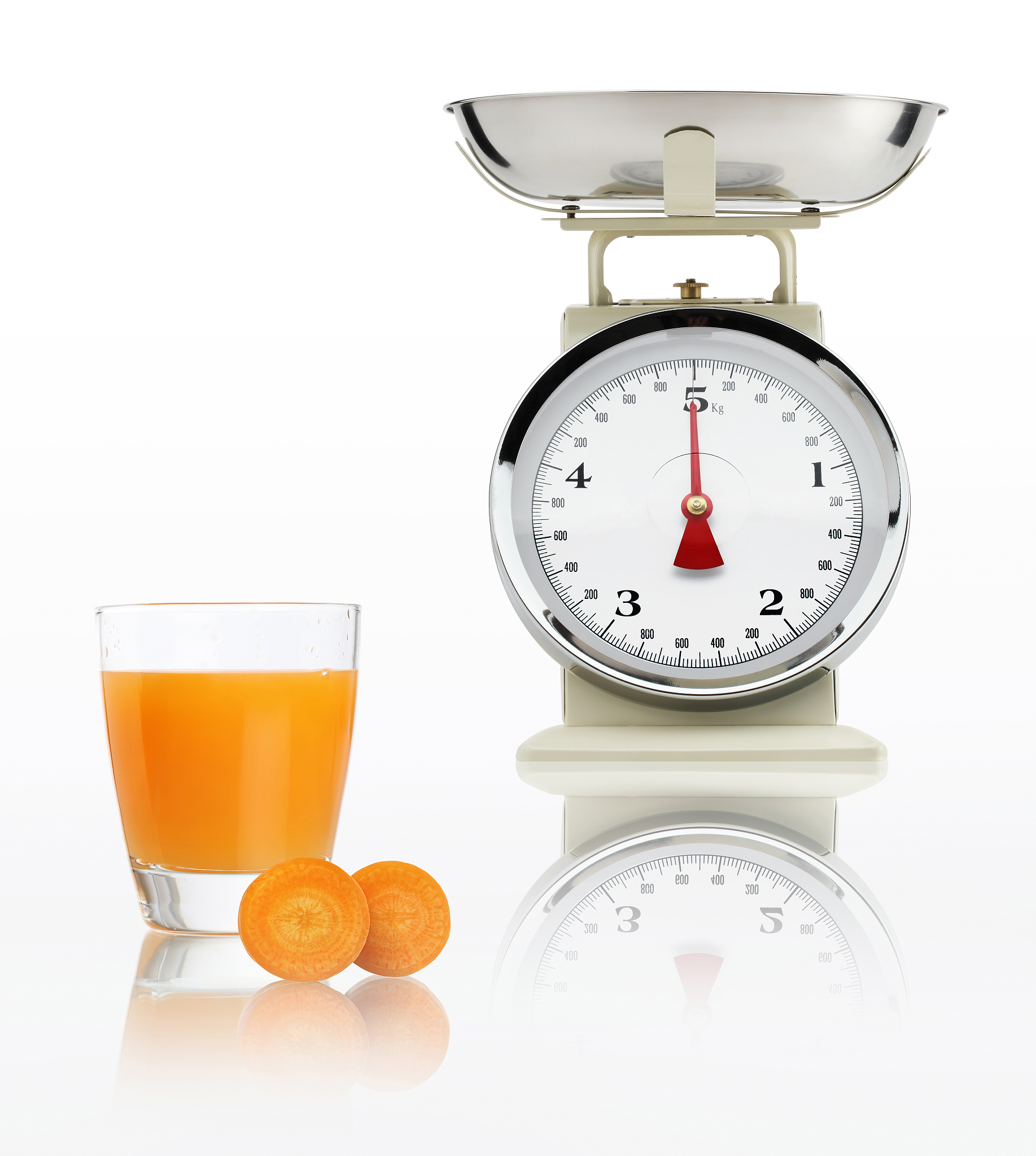 food scale with carrot juice glass isolated on white background,