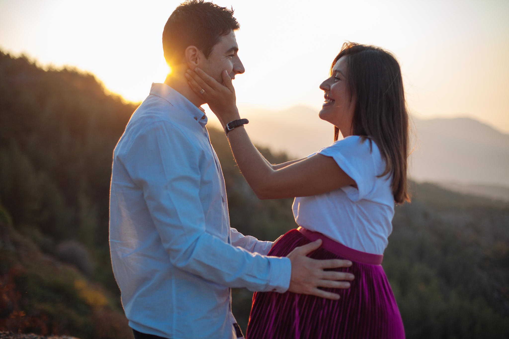 portrait of lovely future parents during sunset