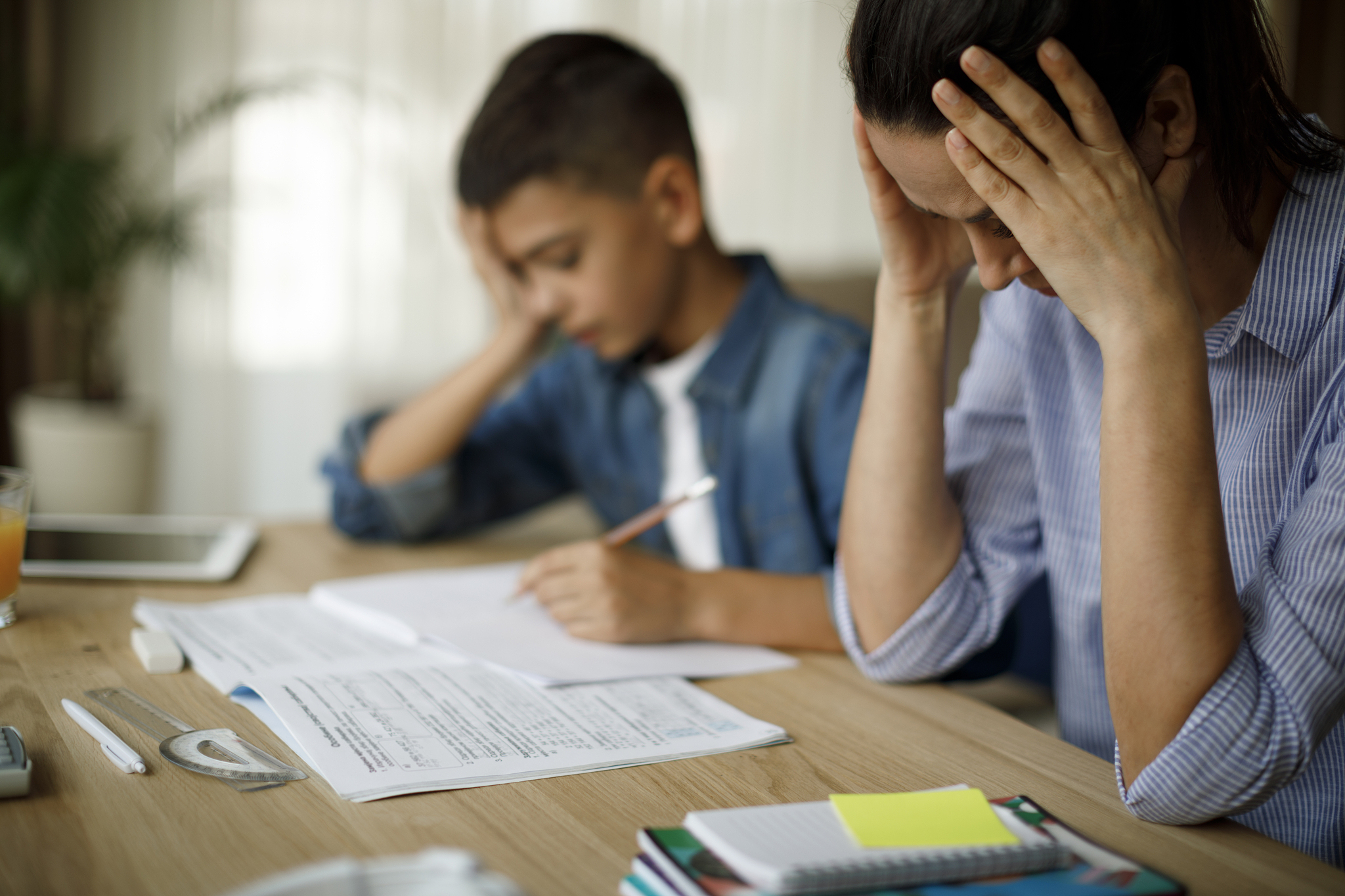 teenage boy having problems in finishing homework