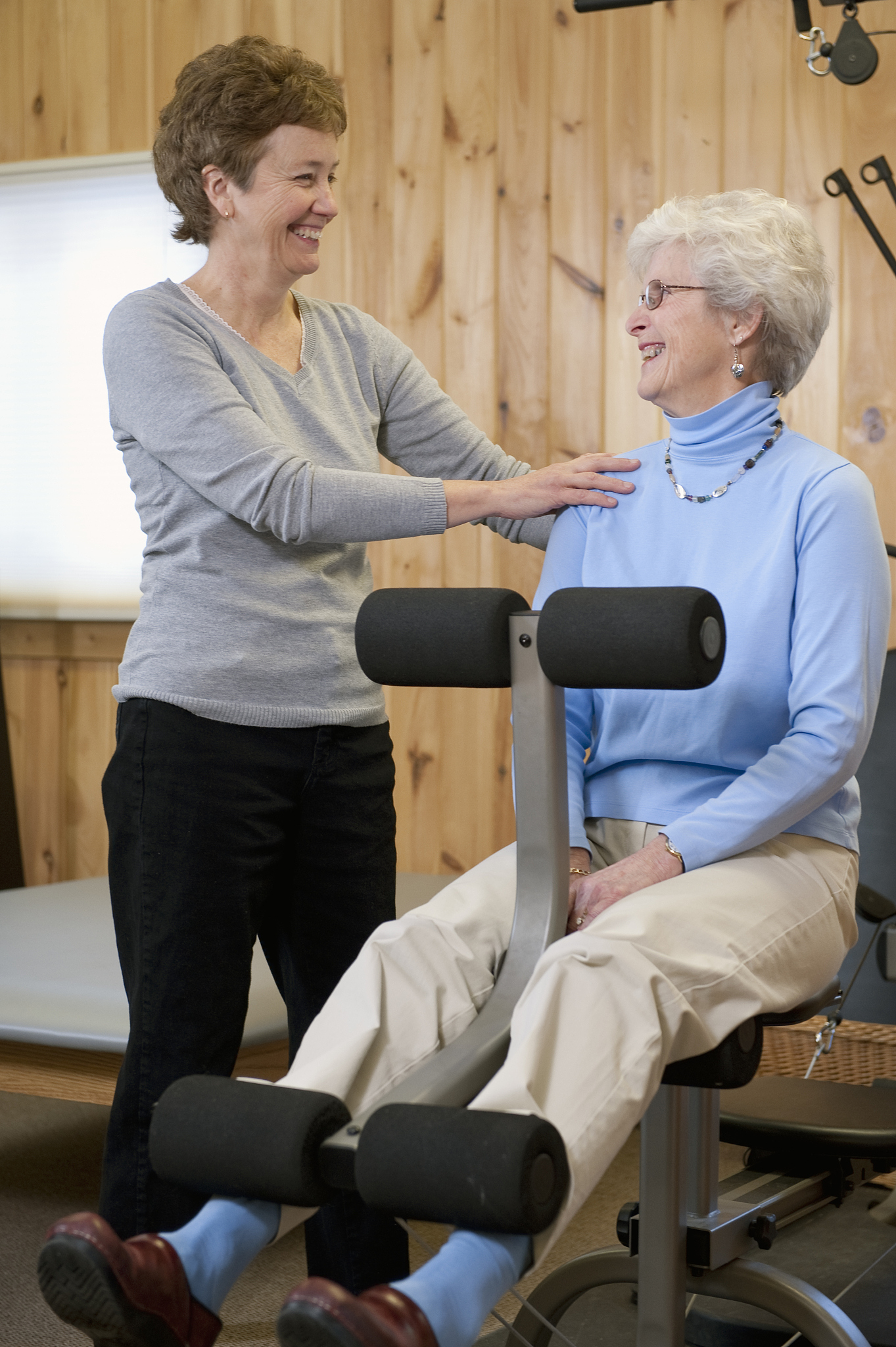 physical therapist helping patient