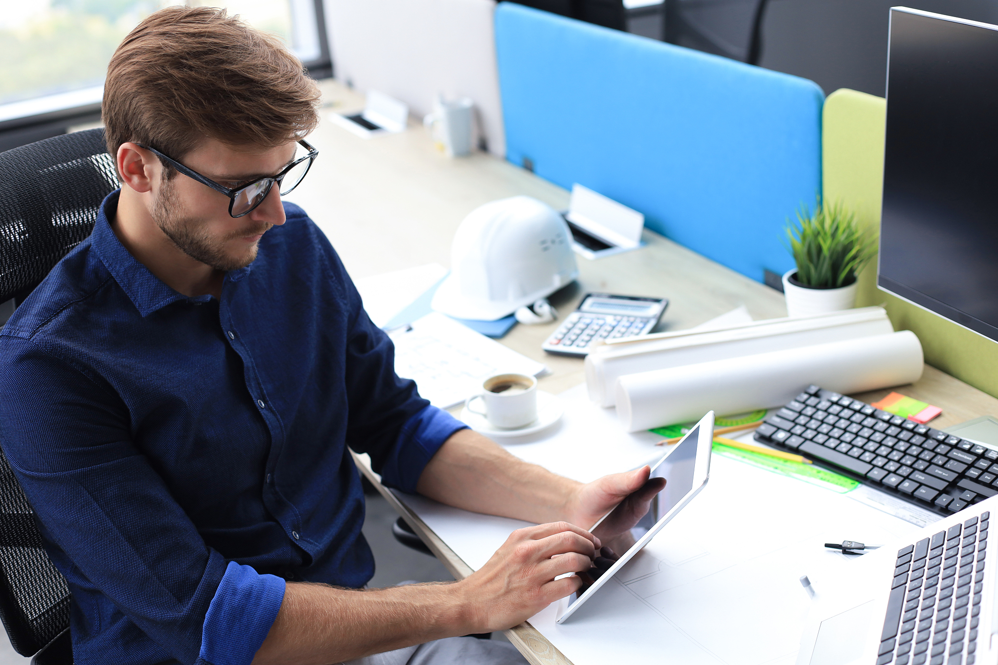 thoughtful young business man working using computer while stand