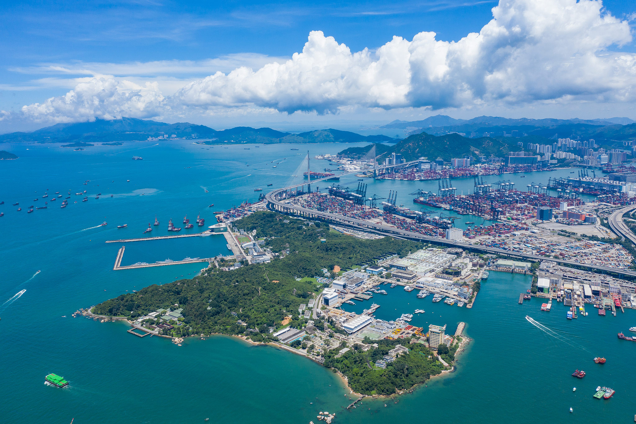 high angle view of sea and cityscape against sky