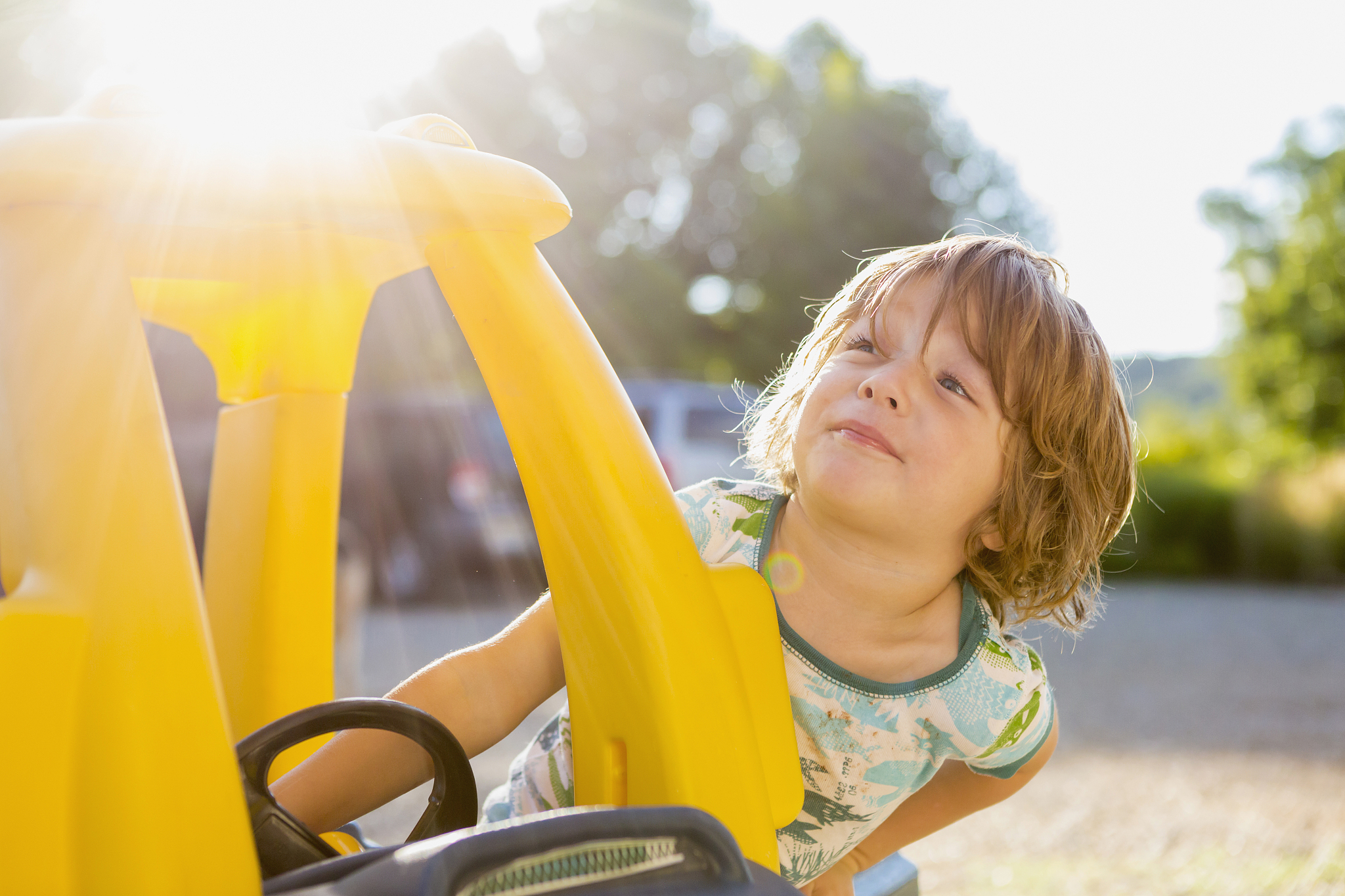 3 year old boy with his toy car