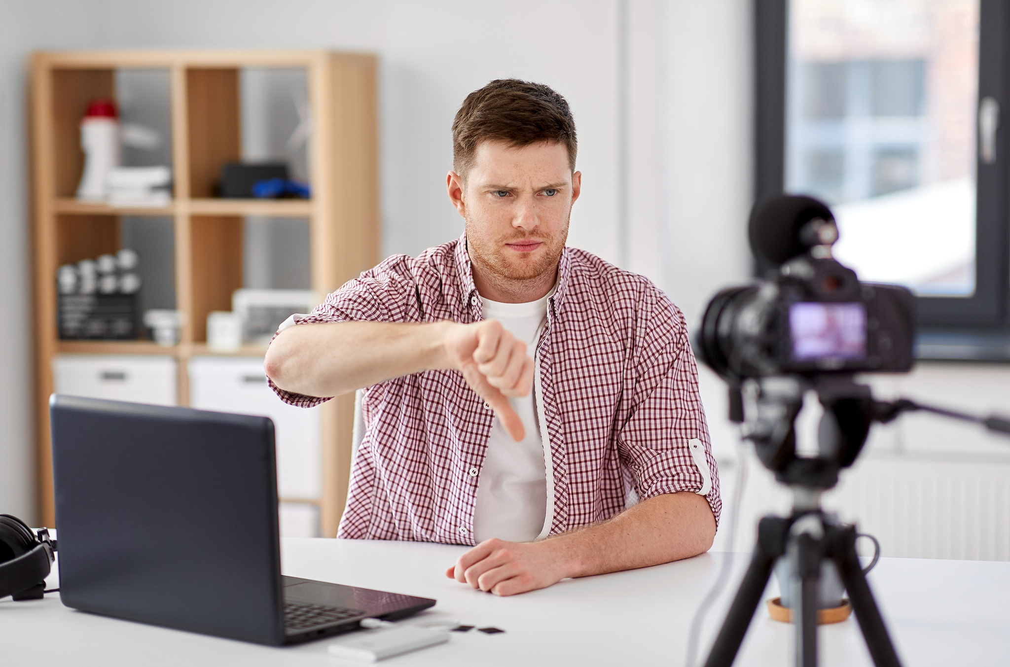 blogging, videoblog and people concept - displeased male blogger