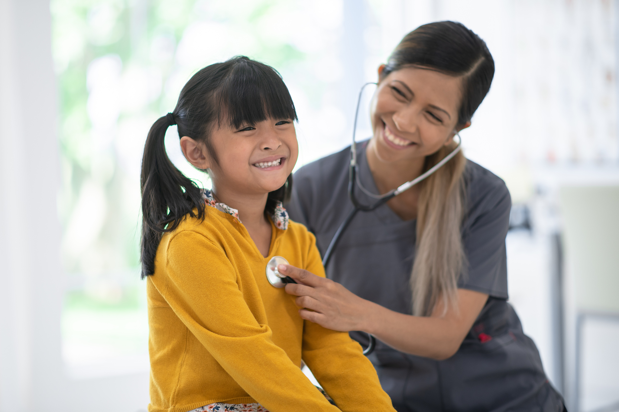 girl getting her pulse taken at the doctor's