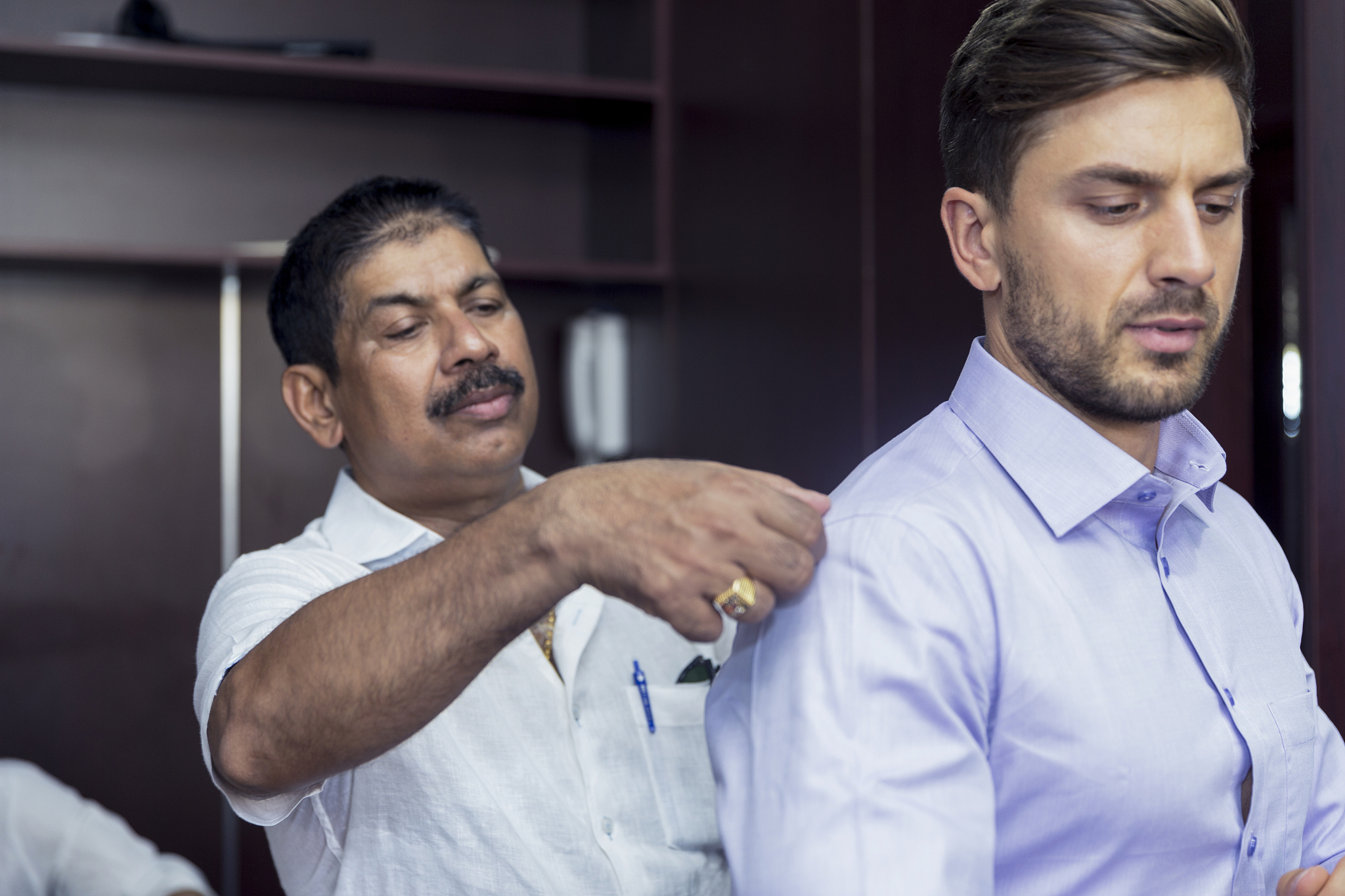 business man having a new shirt fitted for his measurements