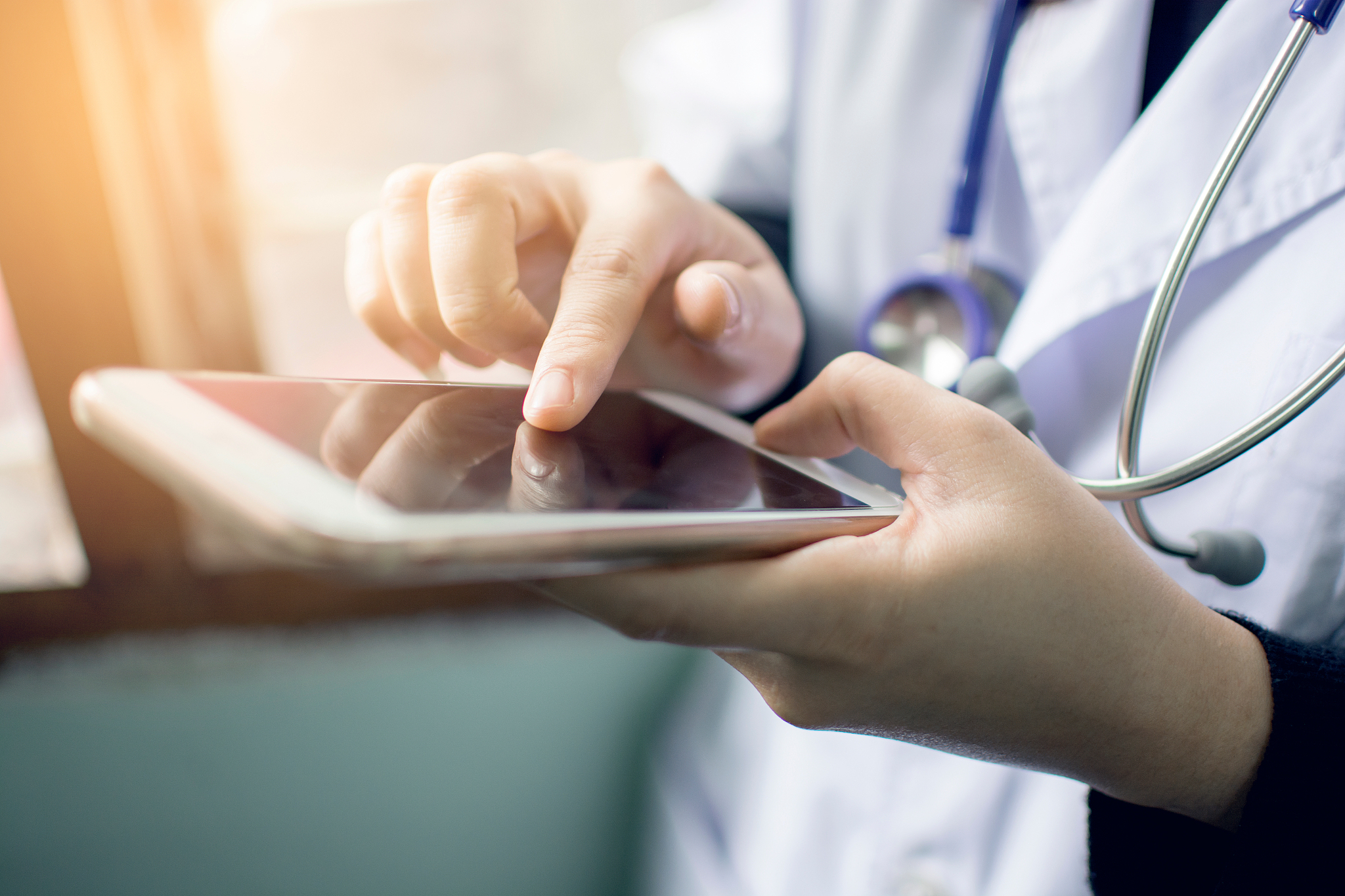 midsection of doctor using phone