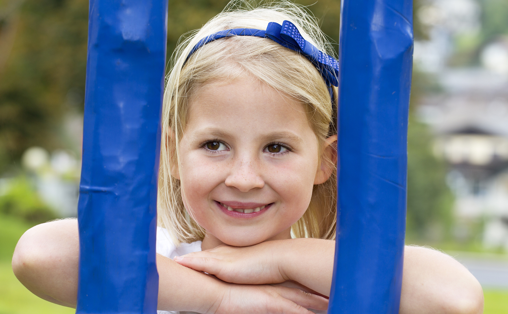 portrait of smiling little girl on a playground