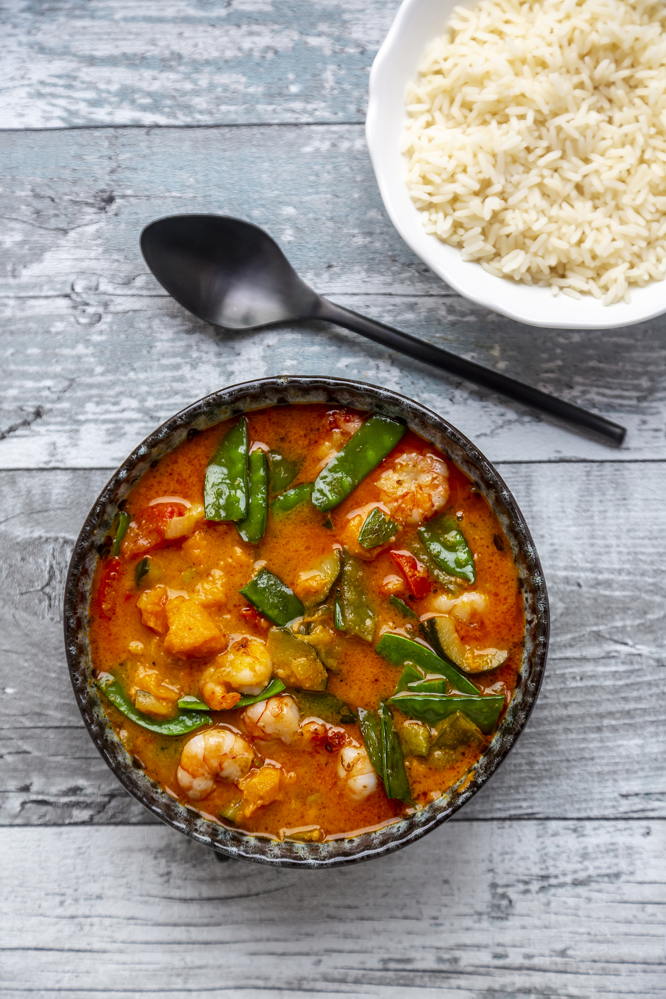 red curry with sweet potato, yellow and red bell pepper, zucchin
