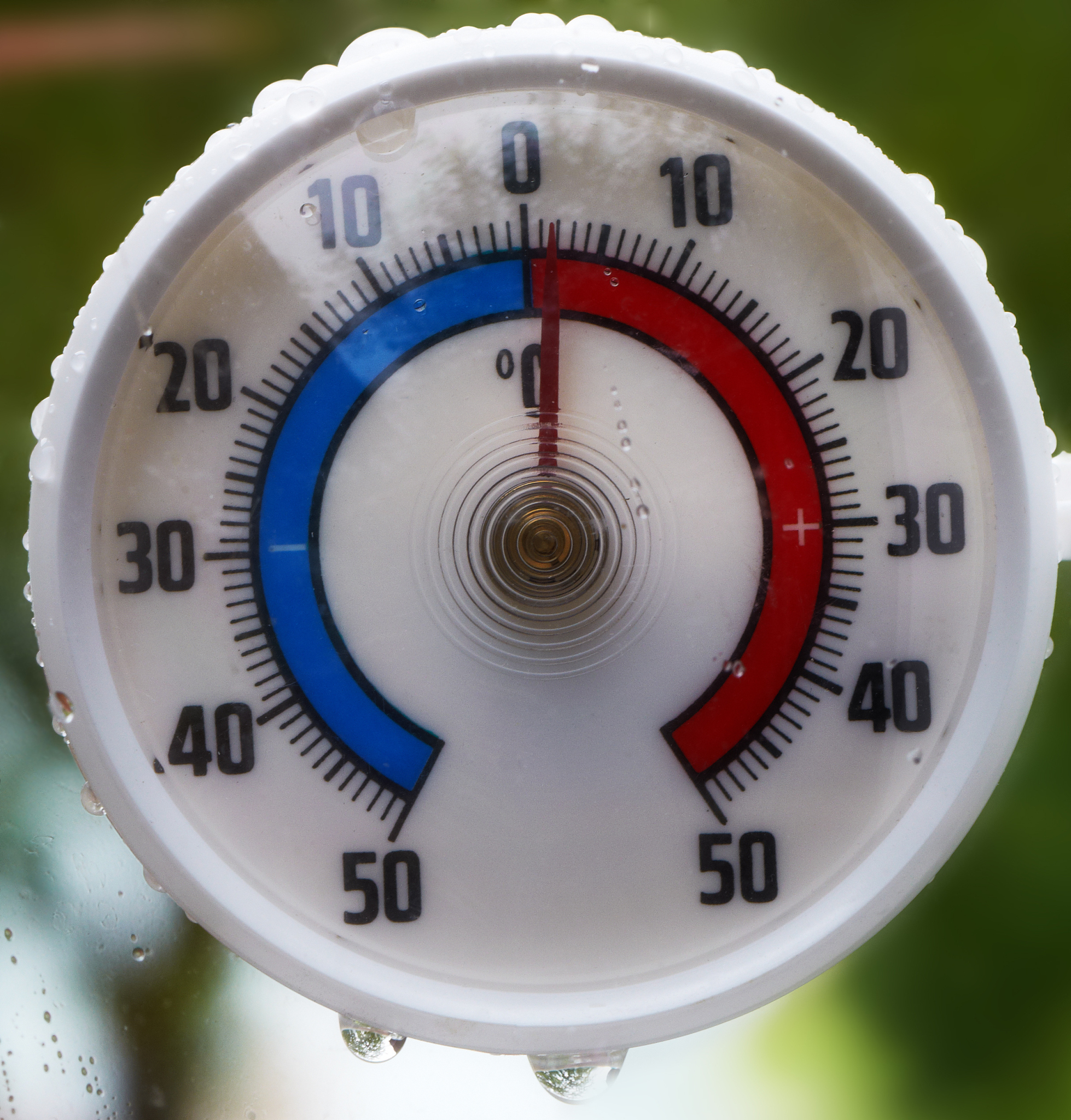 thermometer covered rain drops