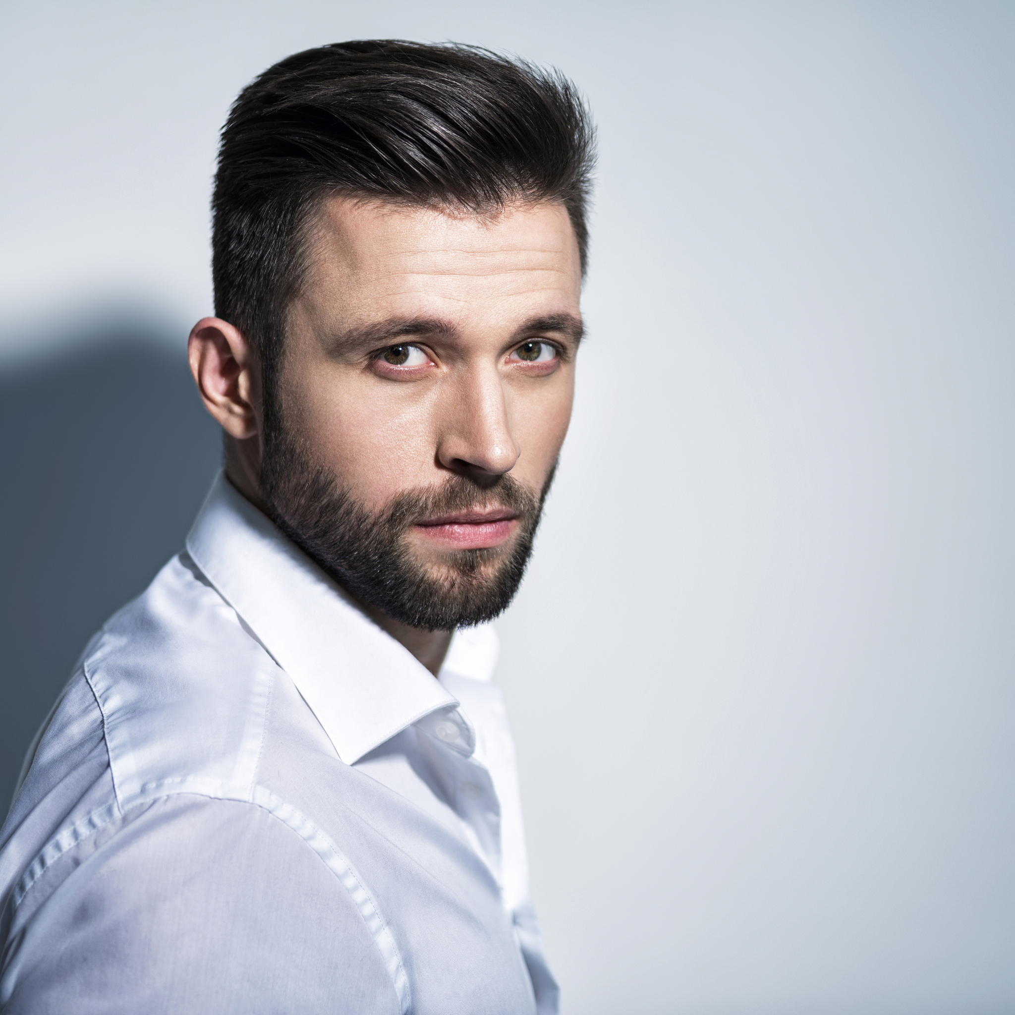 handsome man in white shirt. closeup portrait.