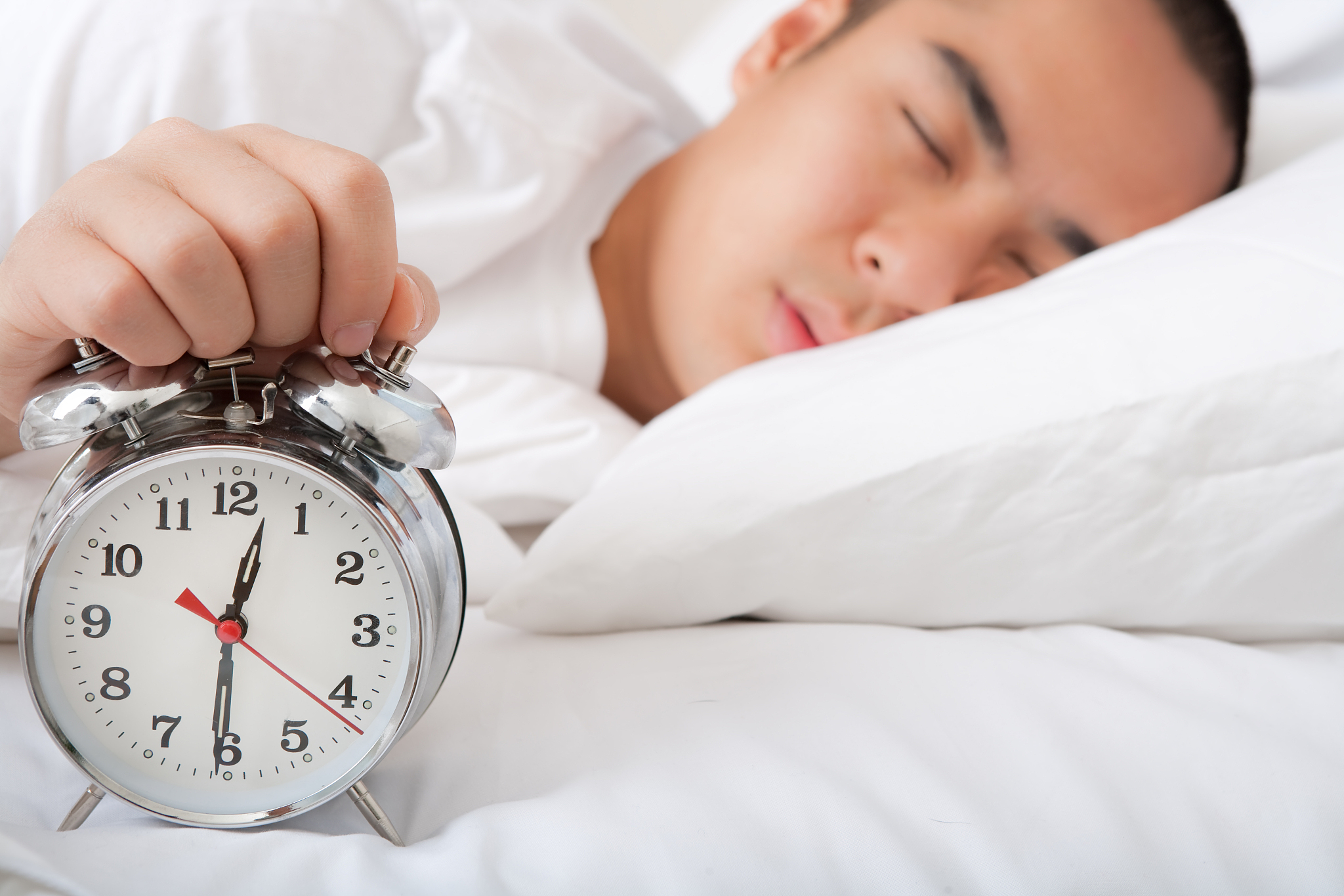 asian sleeping with alarm clock