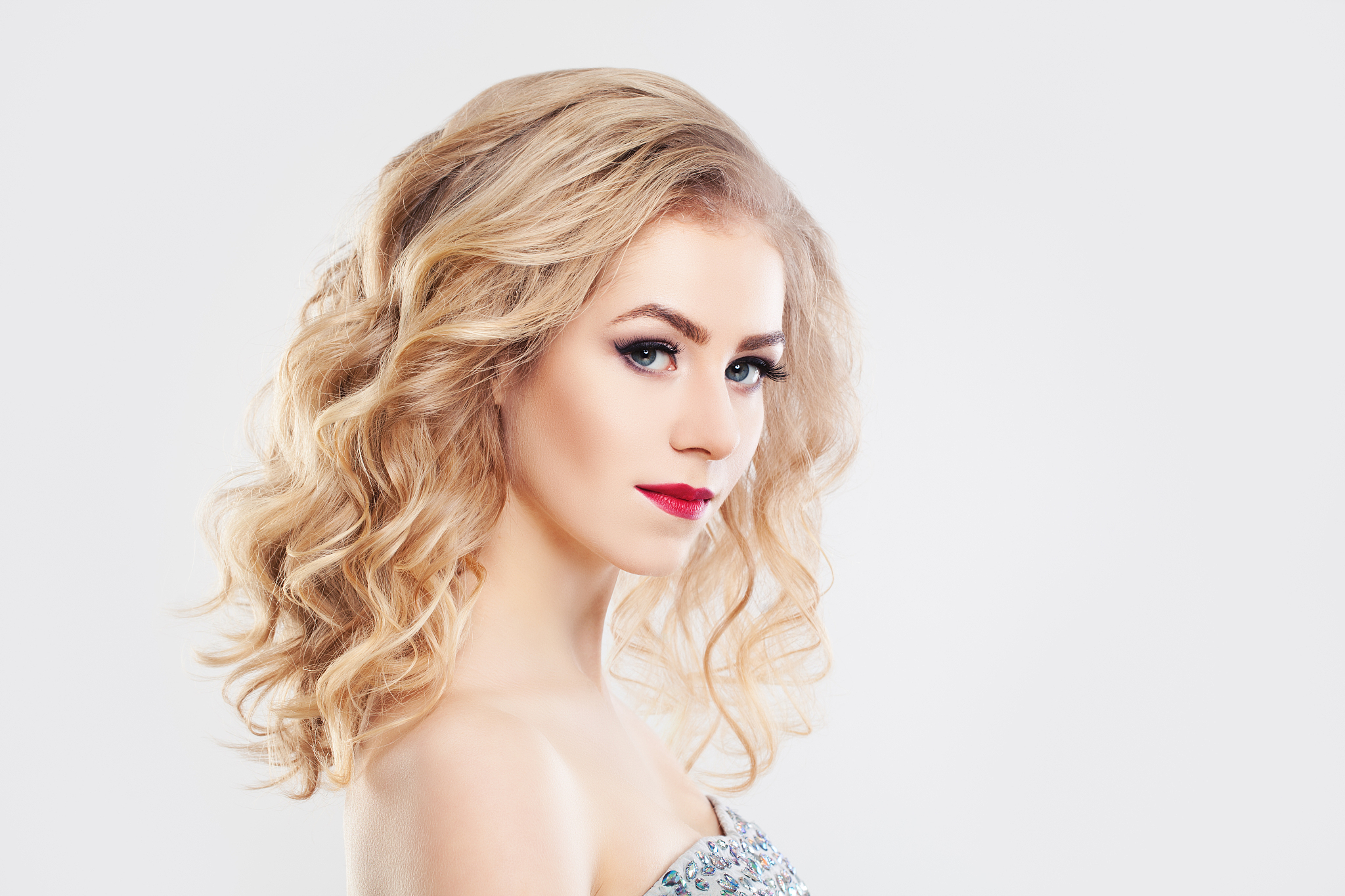glamorous woman fashion mode with curly blonde hair
