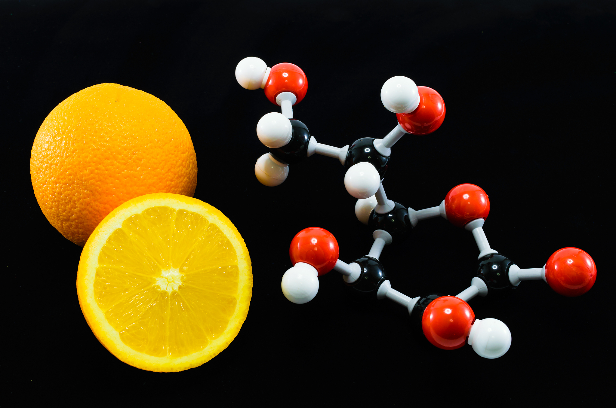 orange and vitamin c structure model (ascorbic acid)