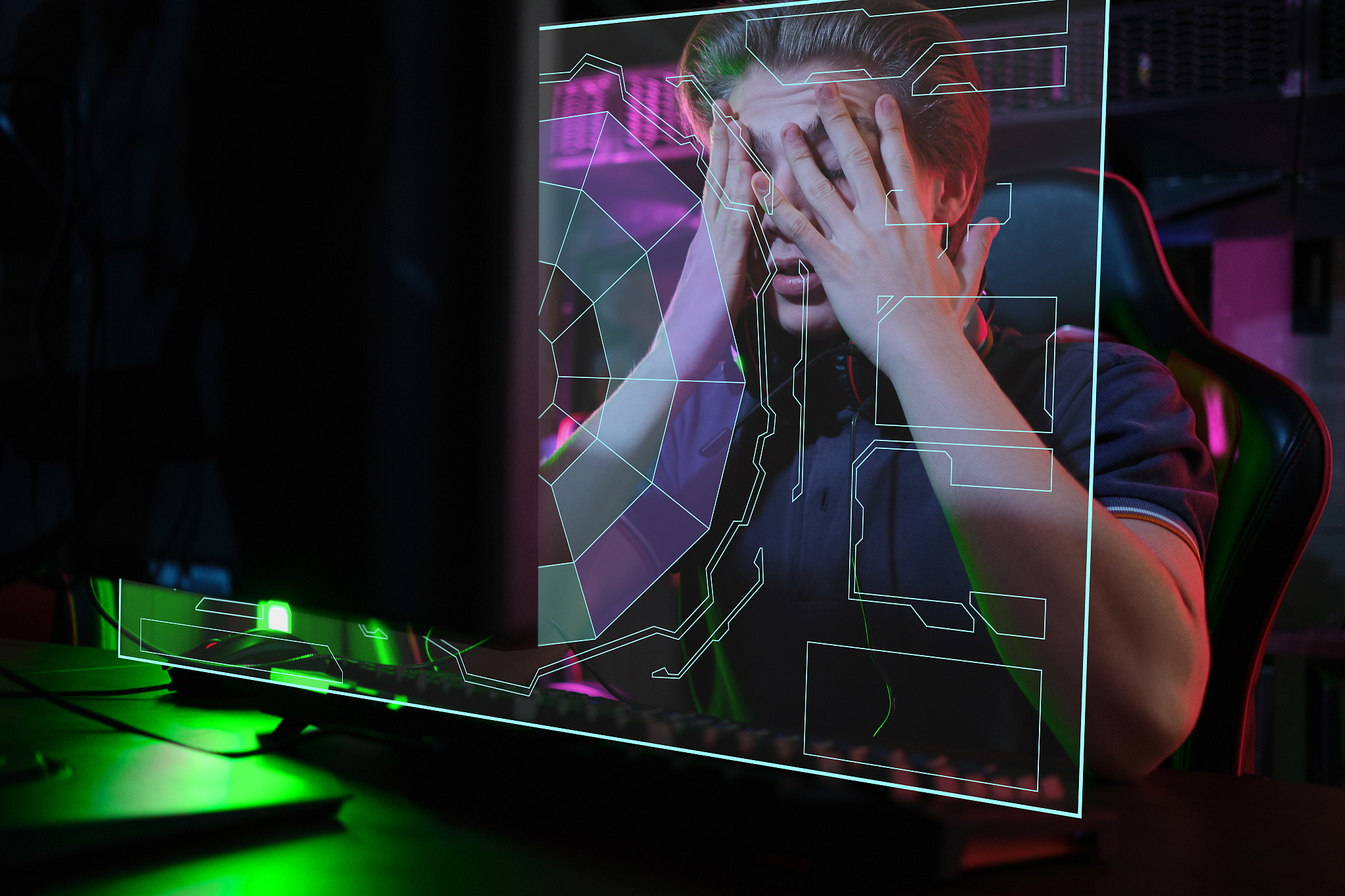 professional young caucasian gamer playing online on his pc. he 