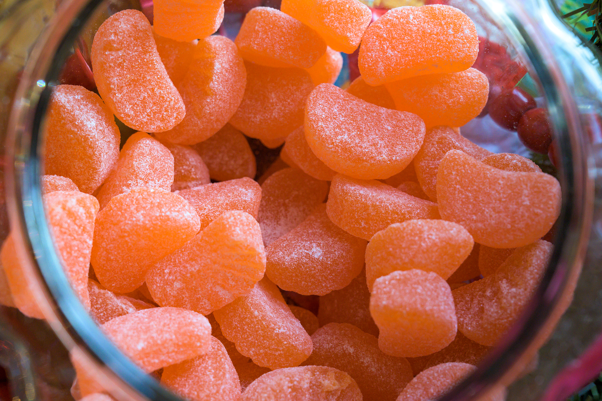 orange gummy candies in jar