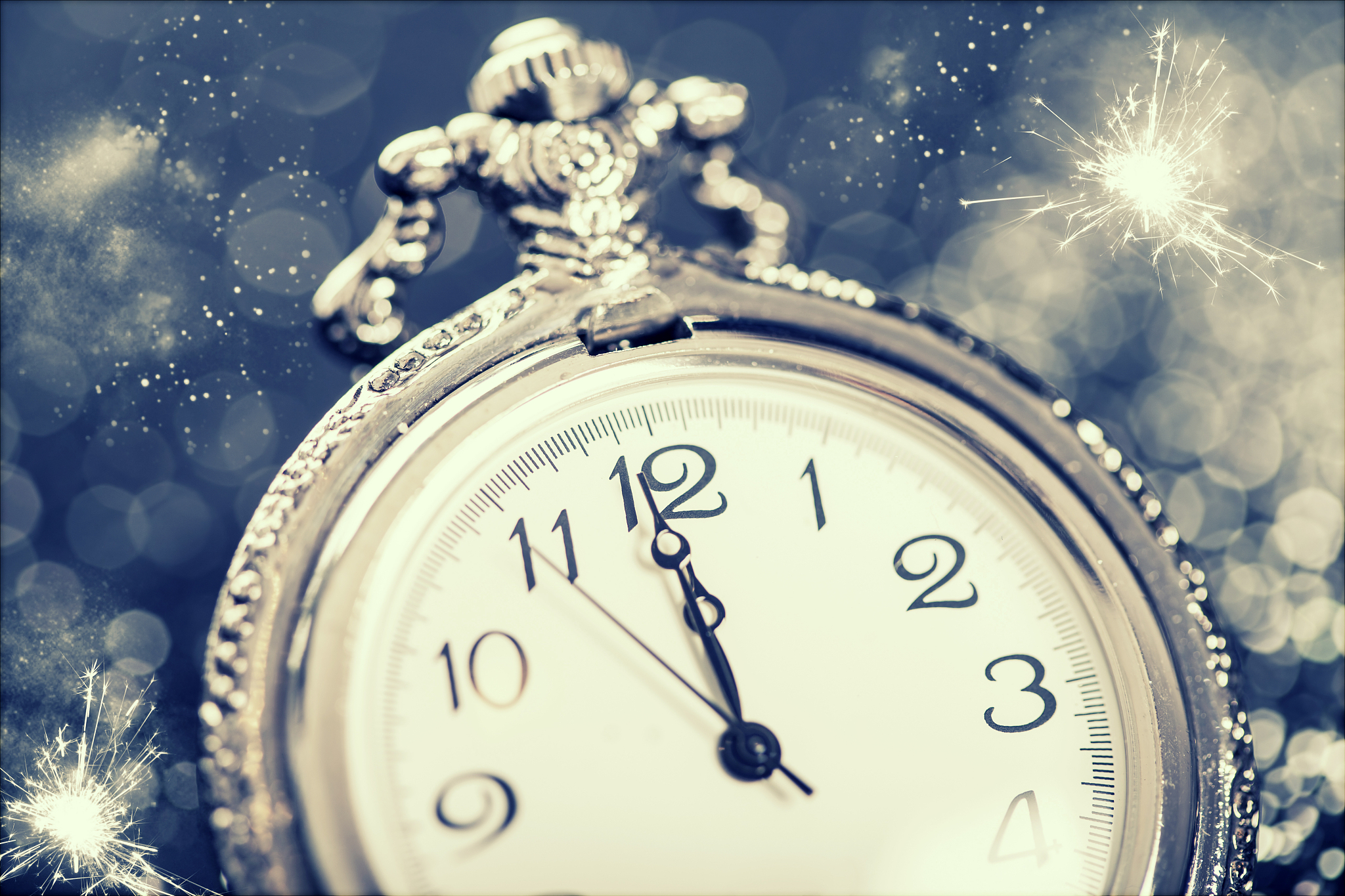 new year's at midnight - old clock and holiday lights